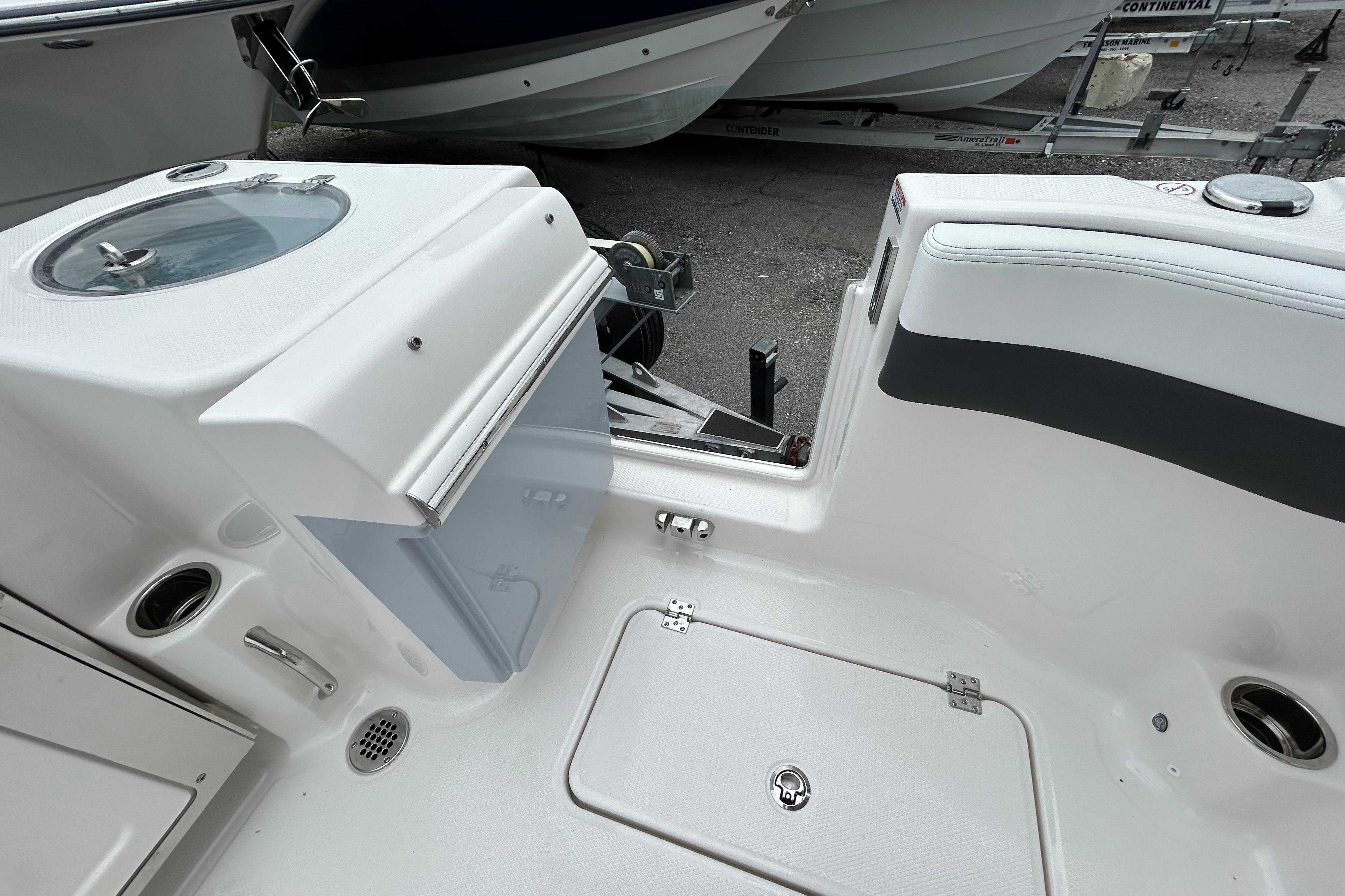 2026 Robalo R277 Dual Console boat interior with storage and seating area.