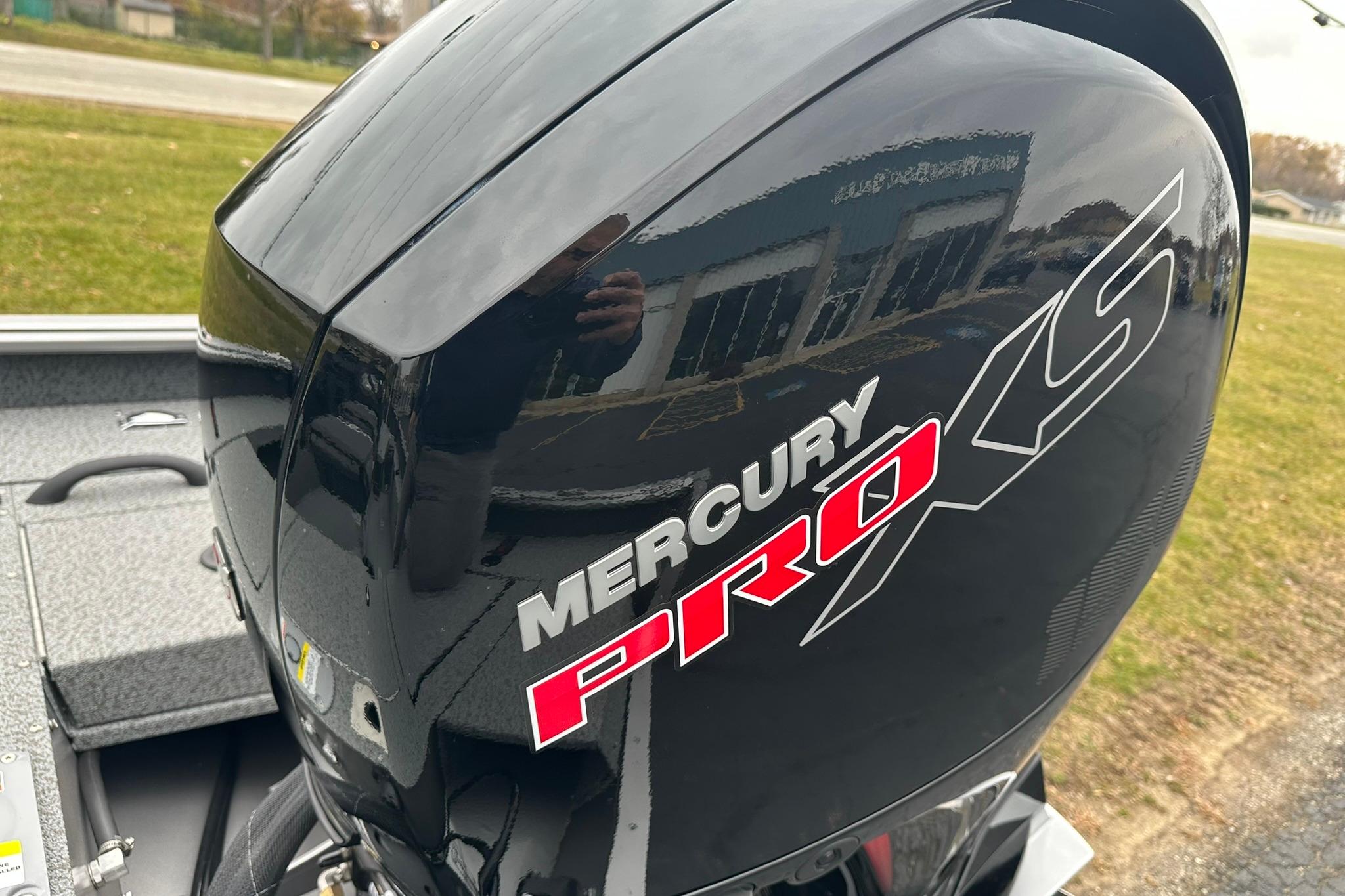 2026 Lund 1875 Impact XS SS with Mercury Pro XS engine, outdoor setting.