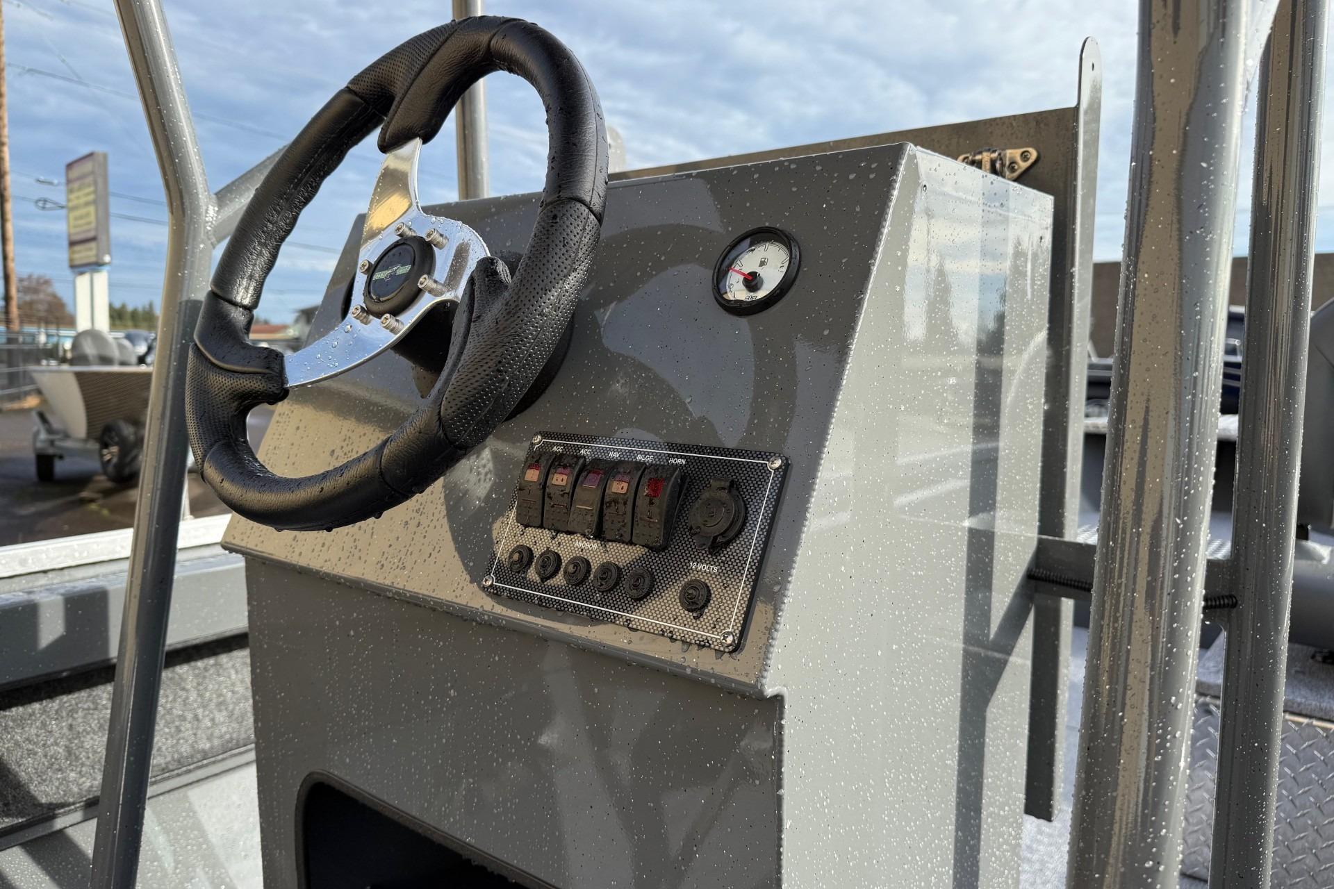2026 Fish Rite Angler 18 boat dashboard with steering wheel and control panel.