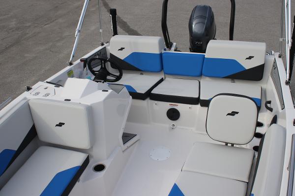 2025 Starcraft SV 16 OB boat interior with blue and white seating and steering console.
