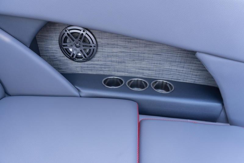 Interior of 2026 Scarab 255 LX Wake boat with speaker and cup holders.