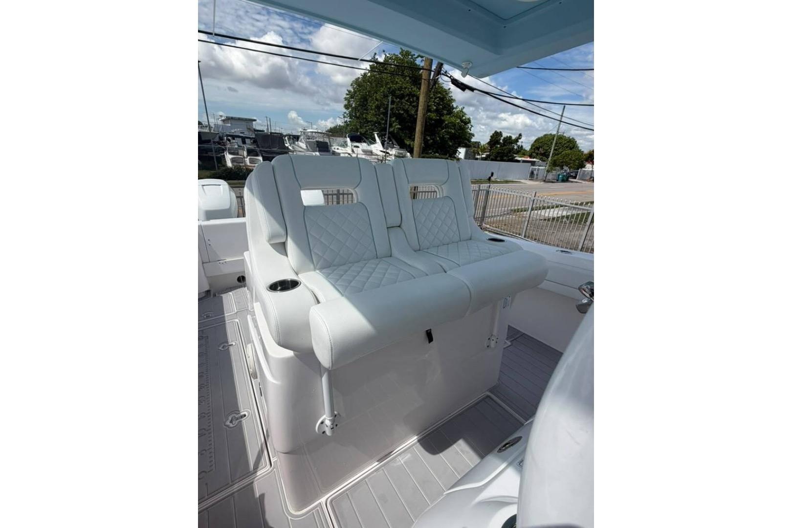 2020 Intrepid 375 Nomad SE boat seating with quilted upholstery and cup holders.