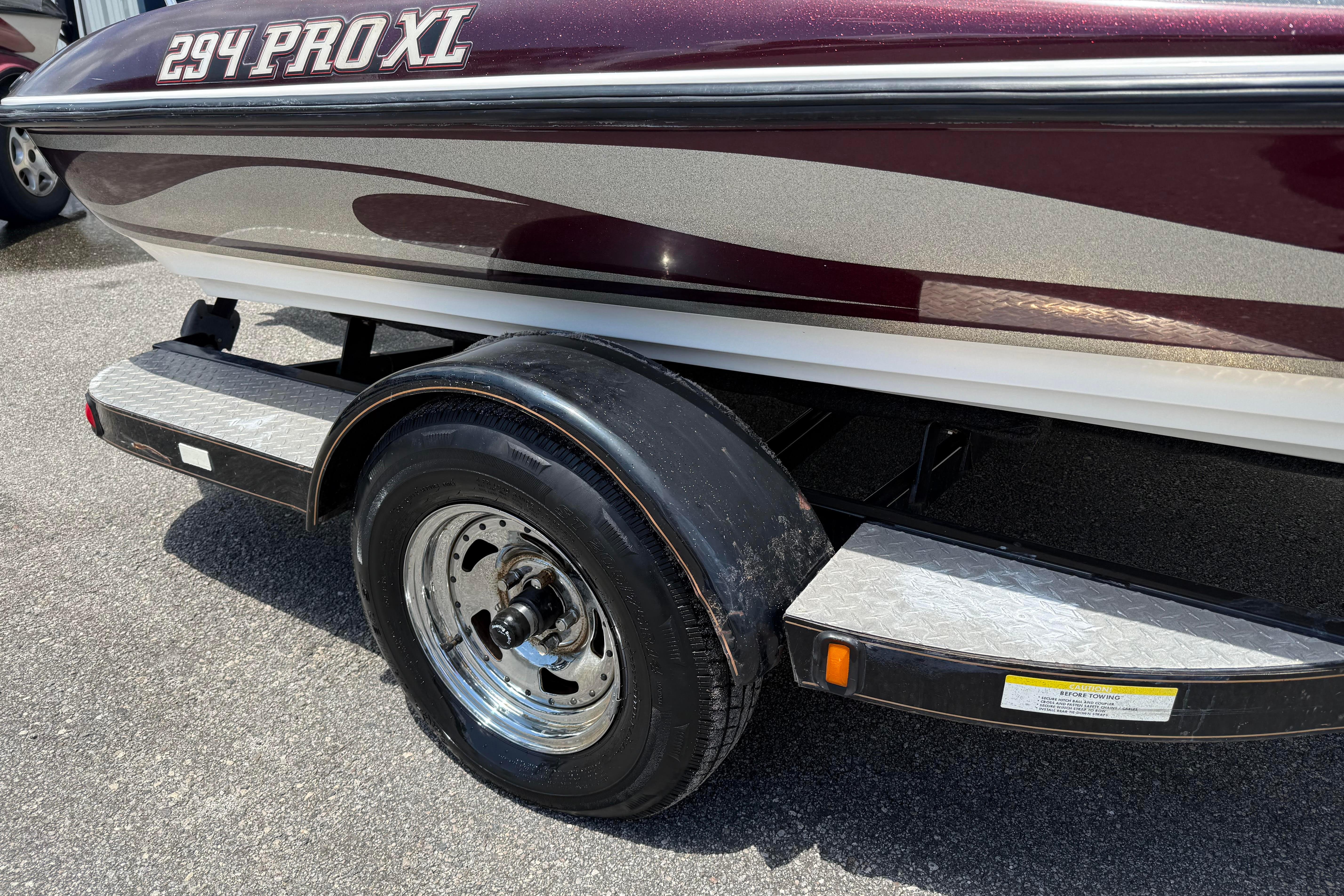 2006 Stratos 294 Pro XL boat trailer with maroon and silver detailing.