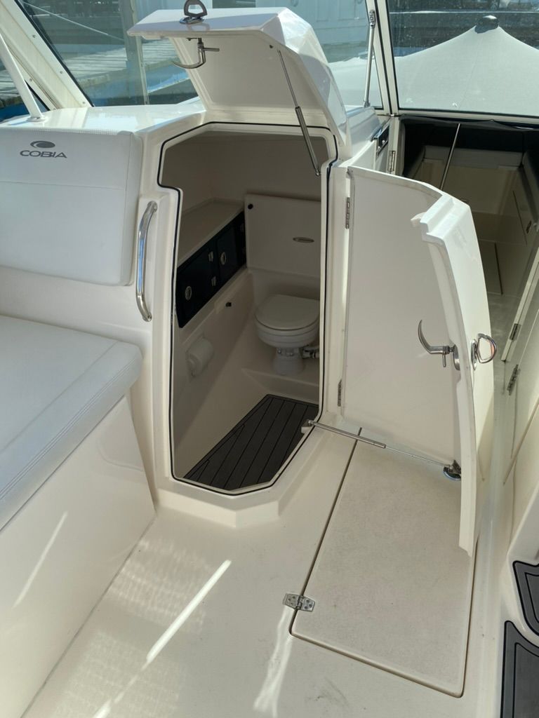 Interior of 2023 Cobia 330 yacht featuring a toilet.