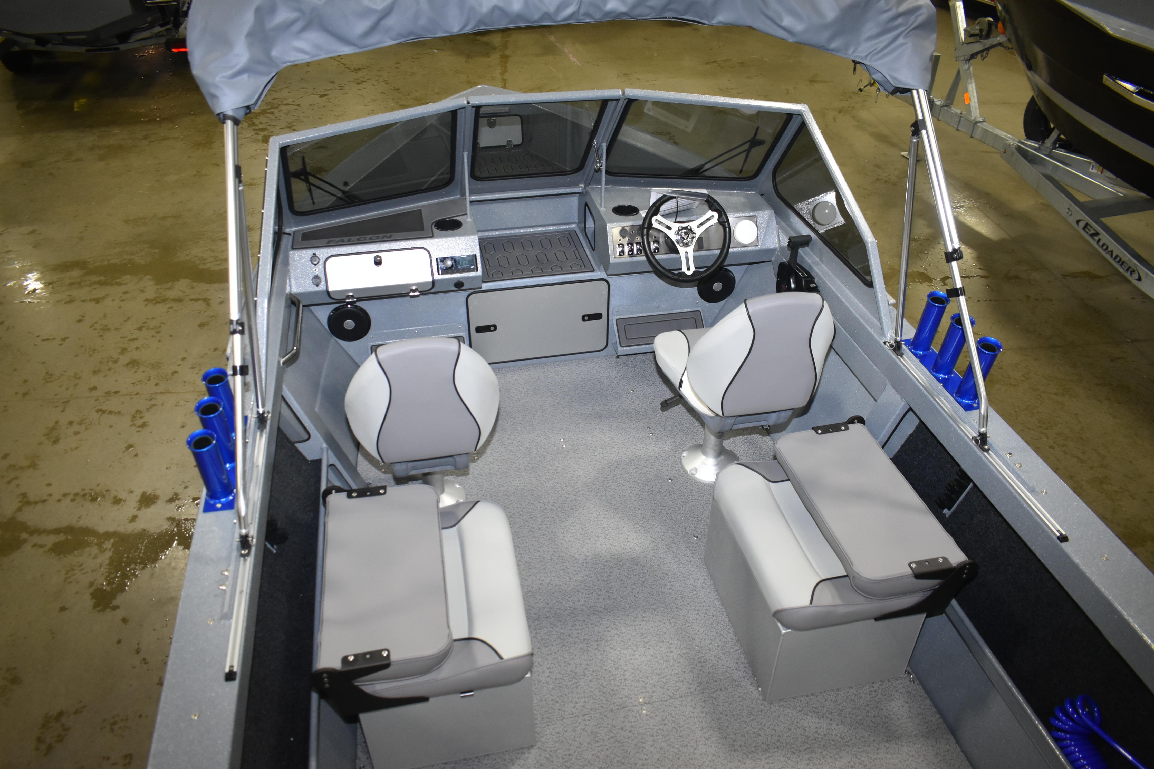 Interior of 2026 KingFisher 1825 Falcon boat with seating and steering console.