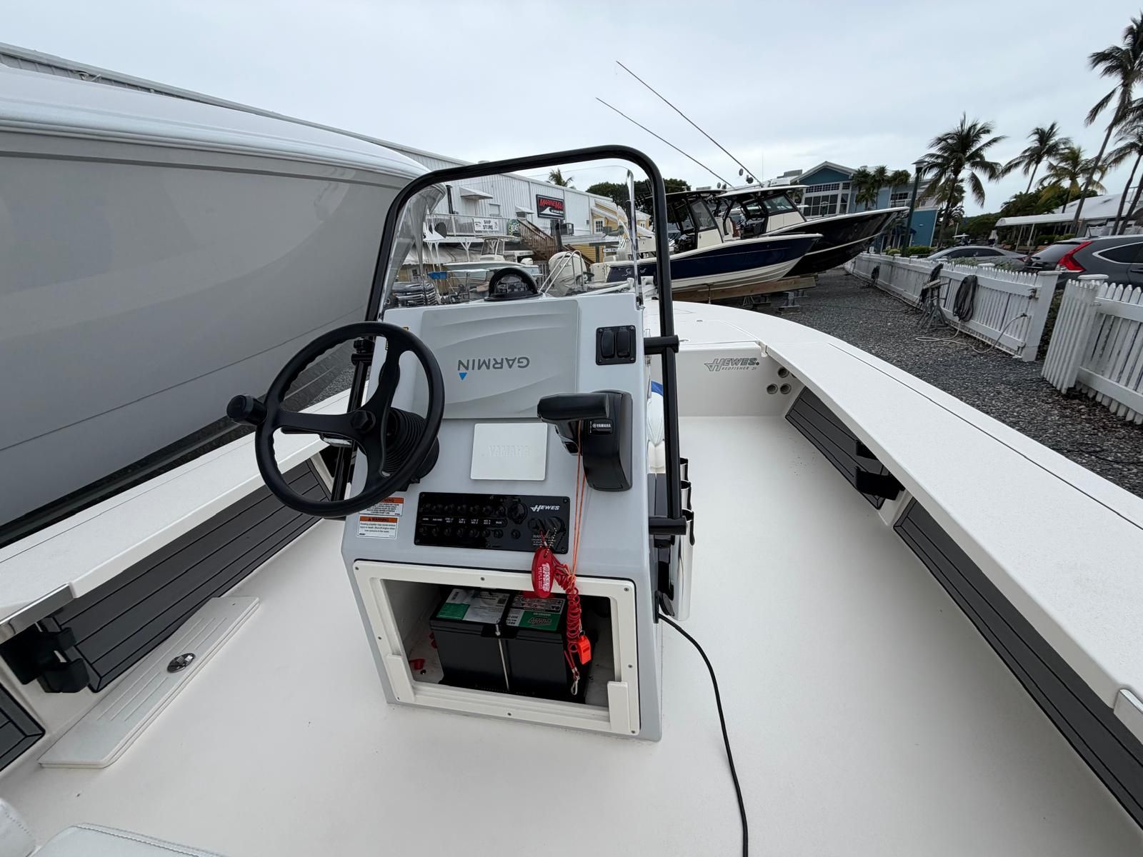 The image shows the cockpit of a 2022 Hewes Redfisher 21 boat with Garmin equipment.