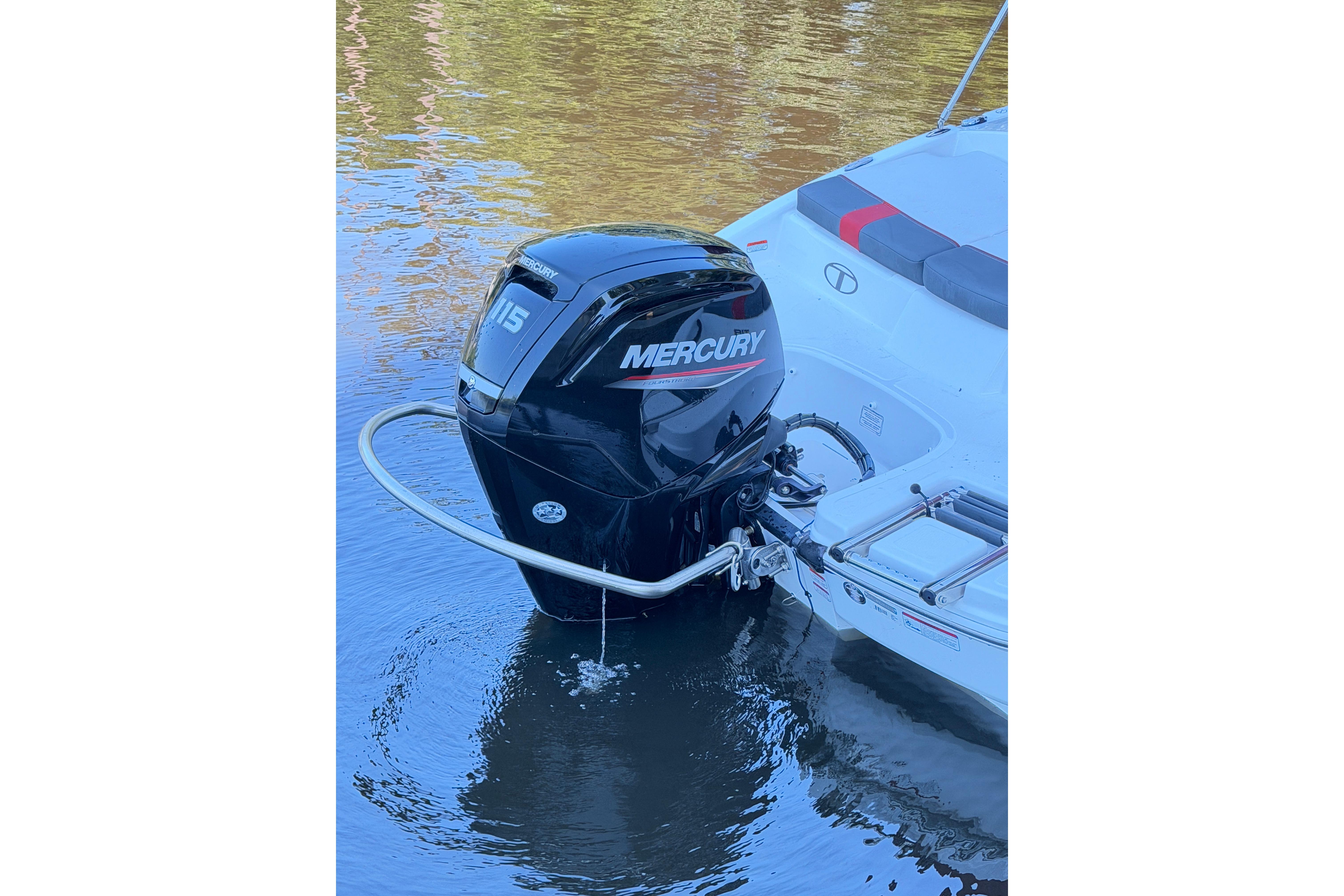 2022 Tahoe T18 boat with Mercury 115 outboard motor on calm water.