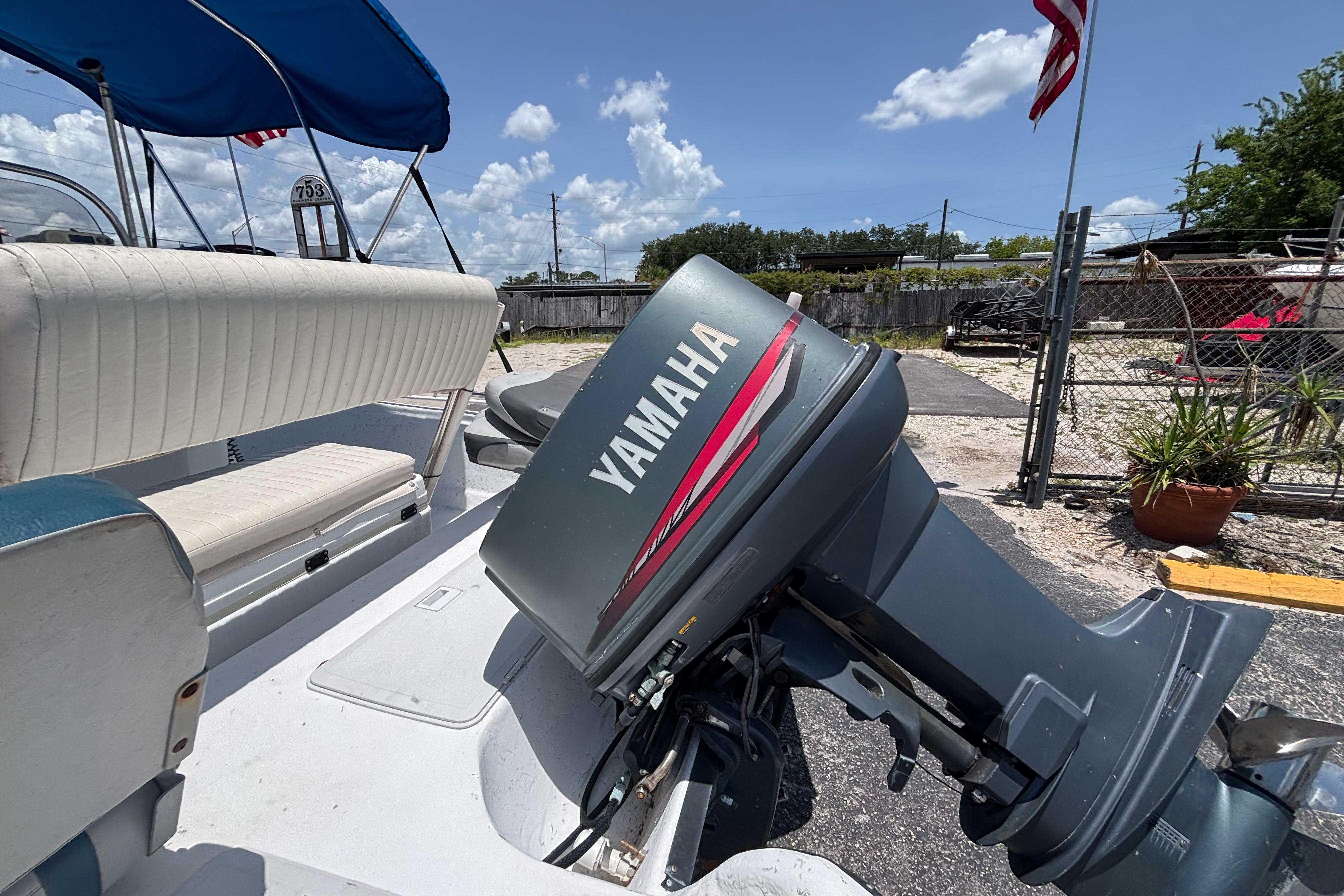 VIP 1880 BAY STEALTH boat with Yamaha outboard motor, 2000 model, parked outdoors.