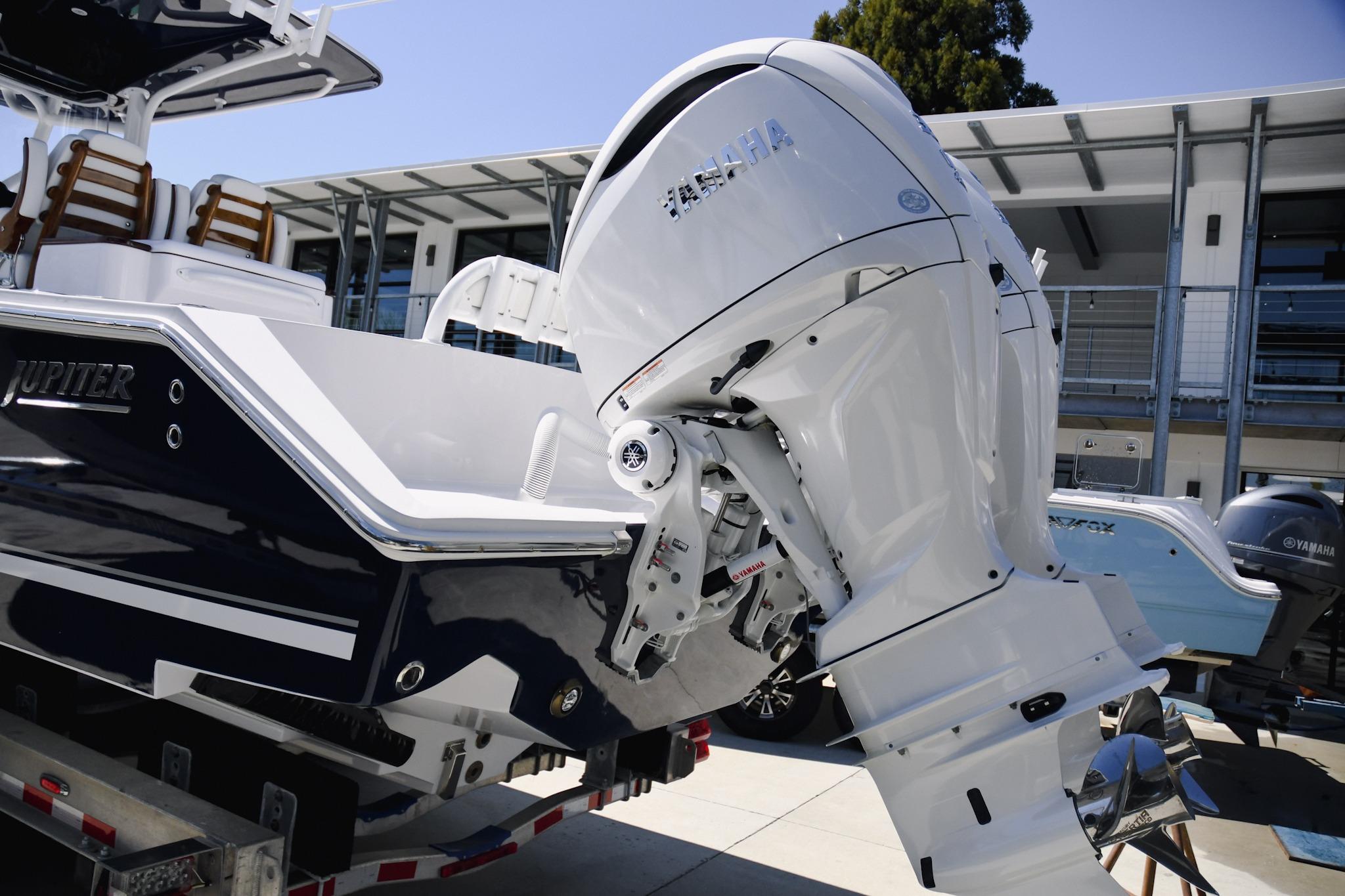 2026 Jupiter 32 boat with Yamaha outboard motor, showcased outdoors.