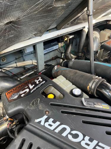 Engine compartment of a 2001 Sea Ray 340 Sundancer with Mercury engine.