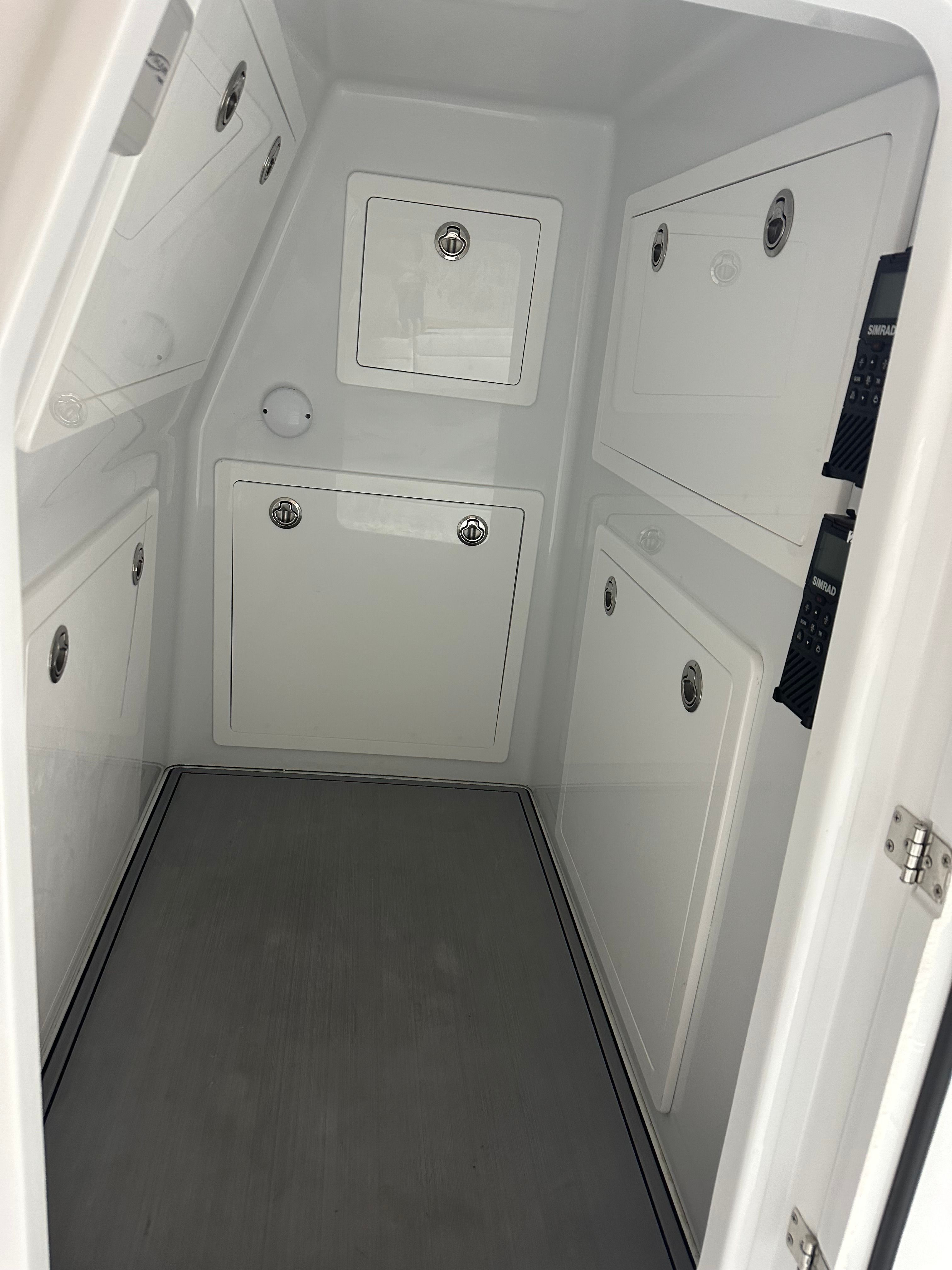 Interior of a Costa Custom Boats 34SV with multiple storage compartments.