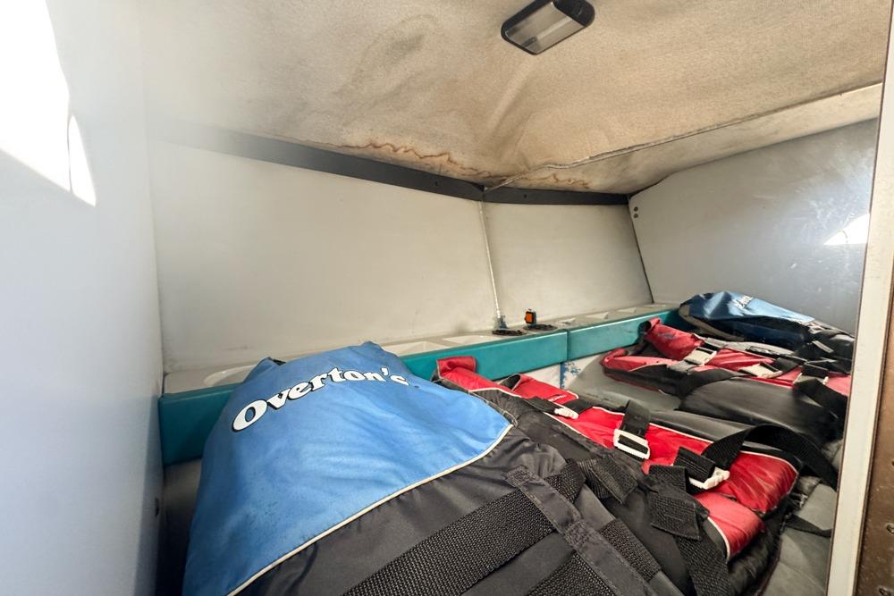 Interior of 1989 Formula 292 SR-1 boat with life jackets and storage area.