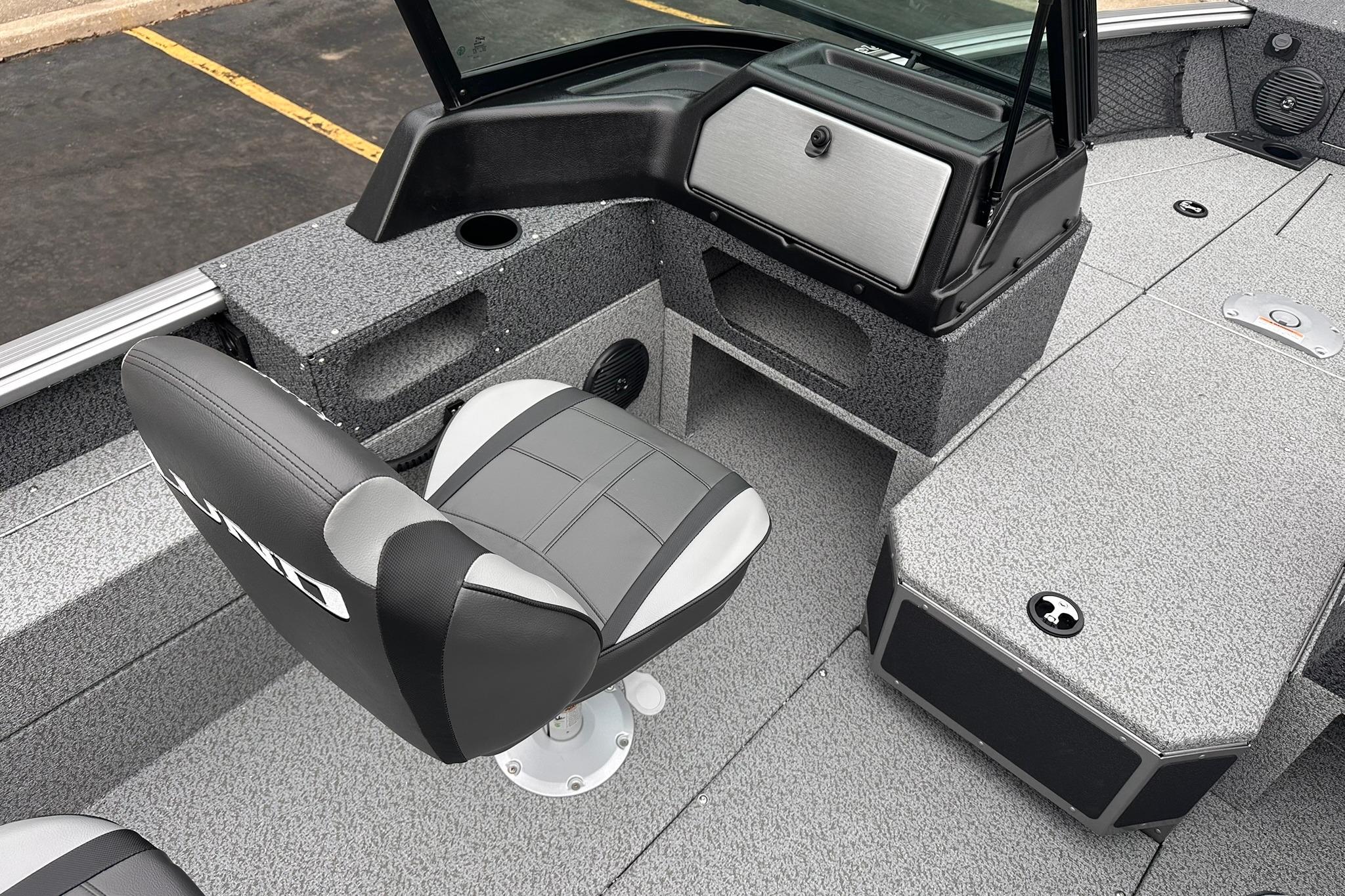 2026 Lund 1775 Impact XS Sport boat interior with seating and storage compartments.