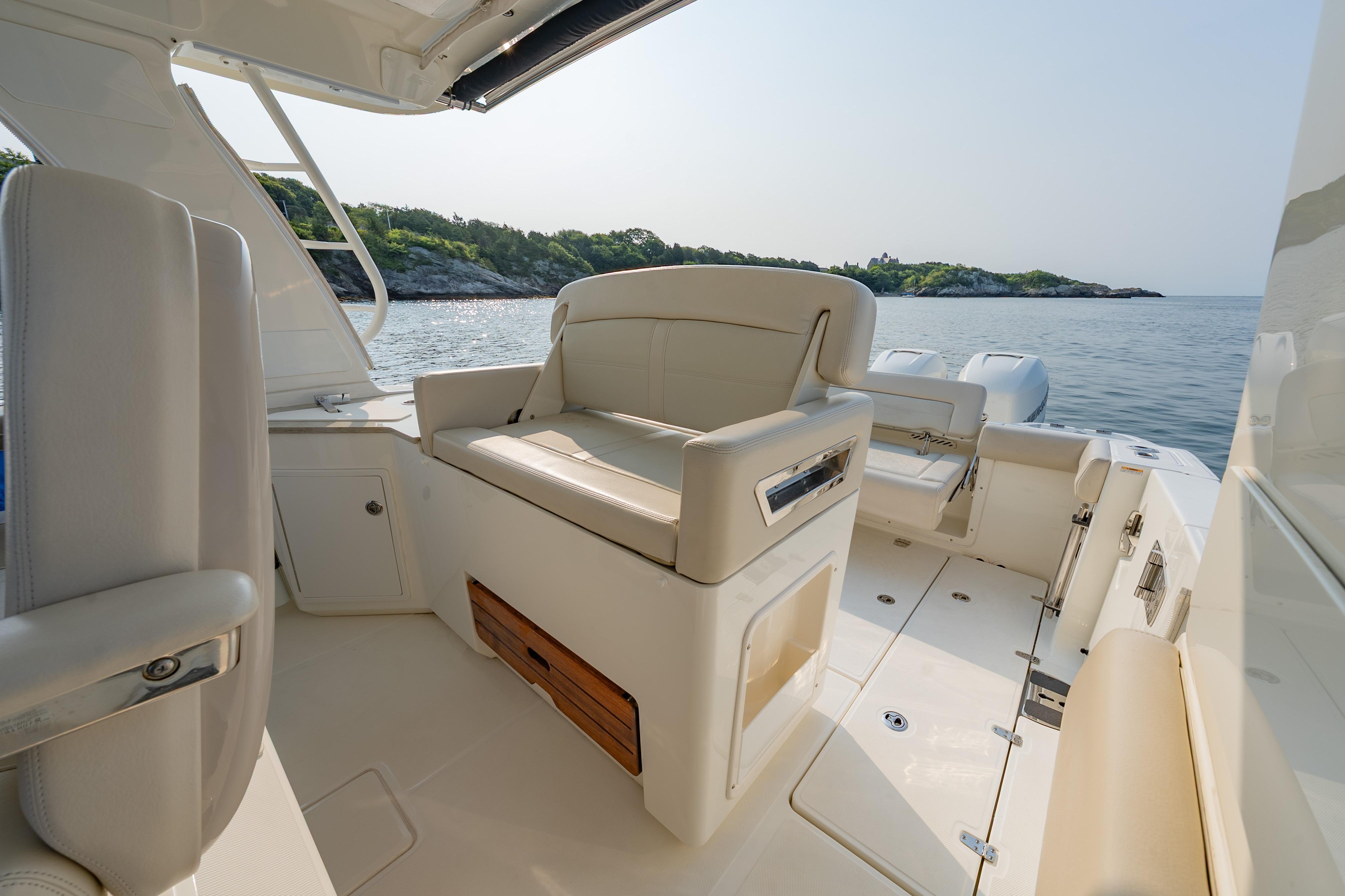 2019 Boston Whaler 350 EX REALM boat interior with seating, on calm water.