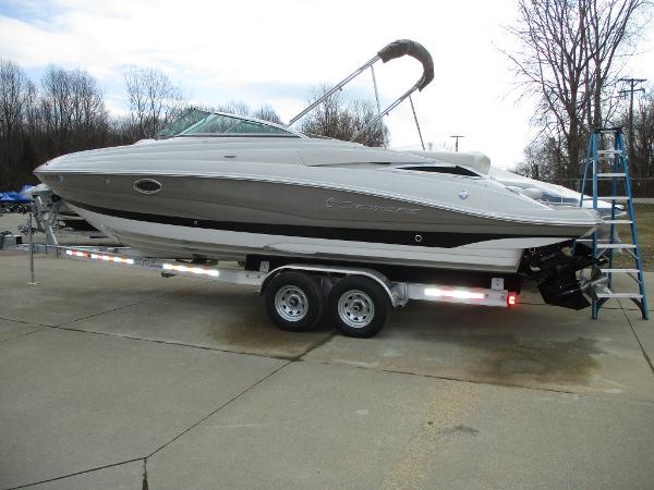 2015 Crownline 285 SS boat on trailer, side view.
