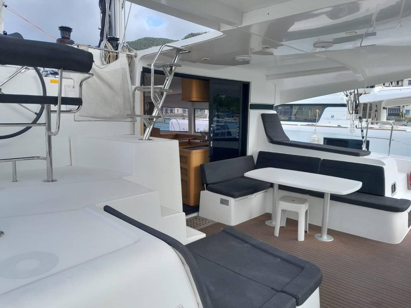 2017 Lagoon 42 yacht with spacious outdoor seating and helm station.