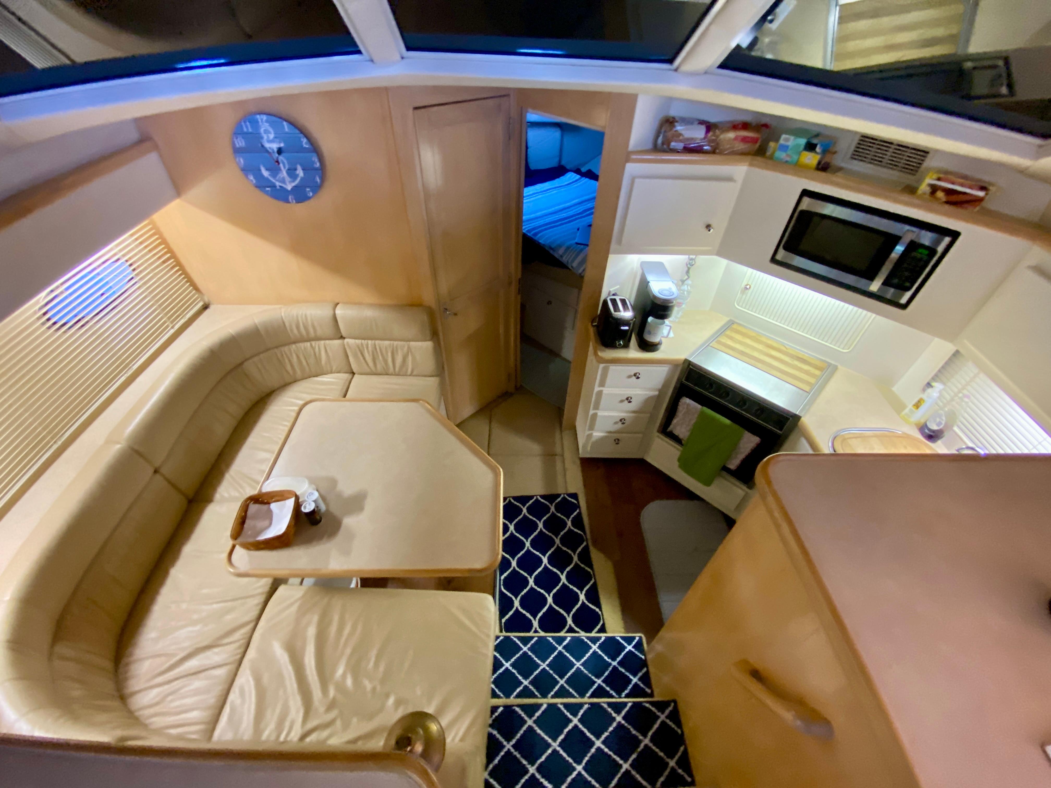 Interior of 1997 Carver 405 Motor Yacht with kitchen and seating area.