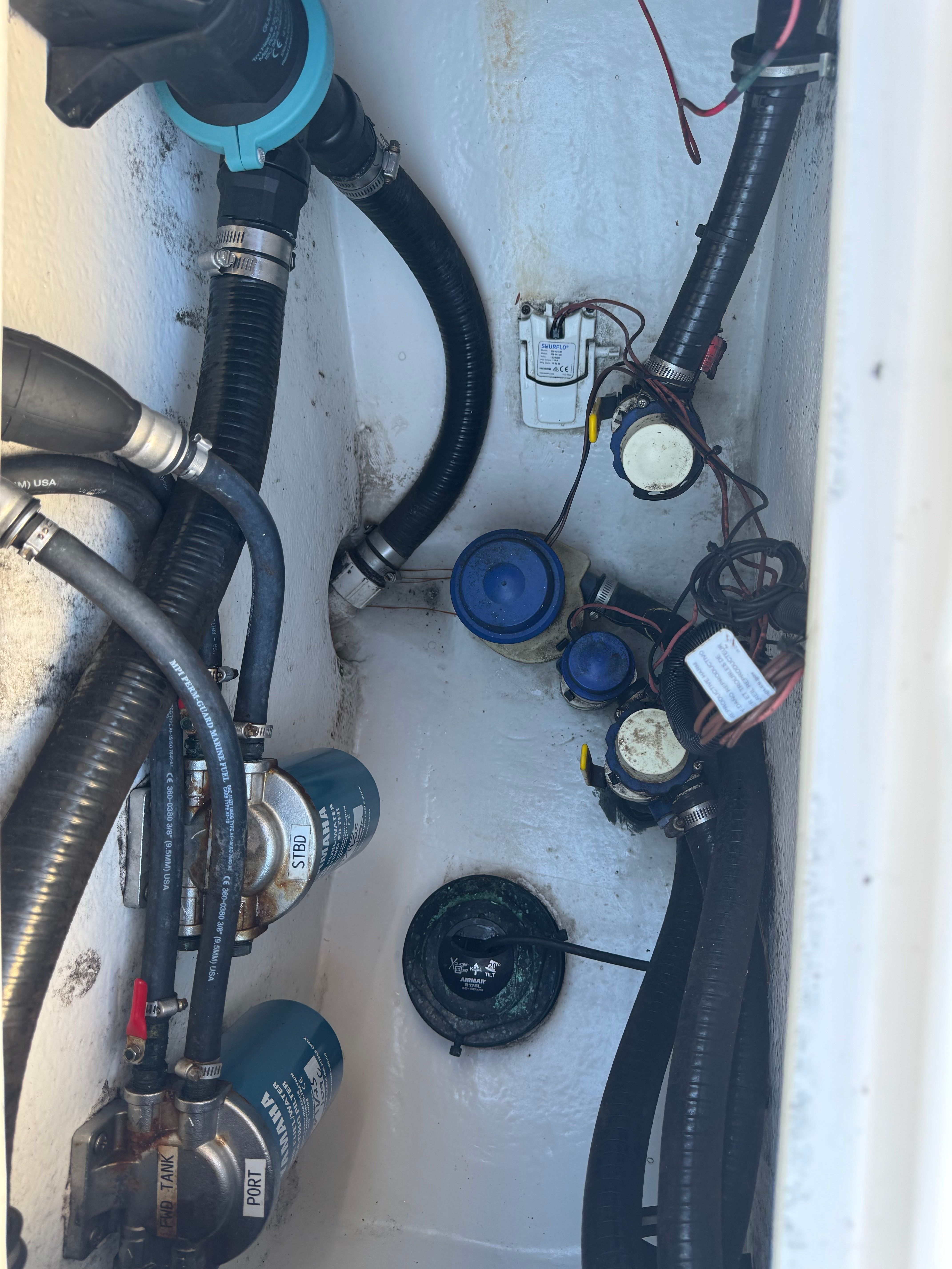 Interior view of Cape Horn 32 XS 2021 with hoses and pumps.