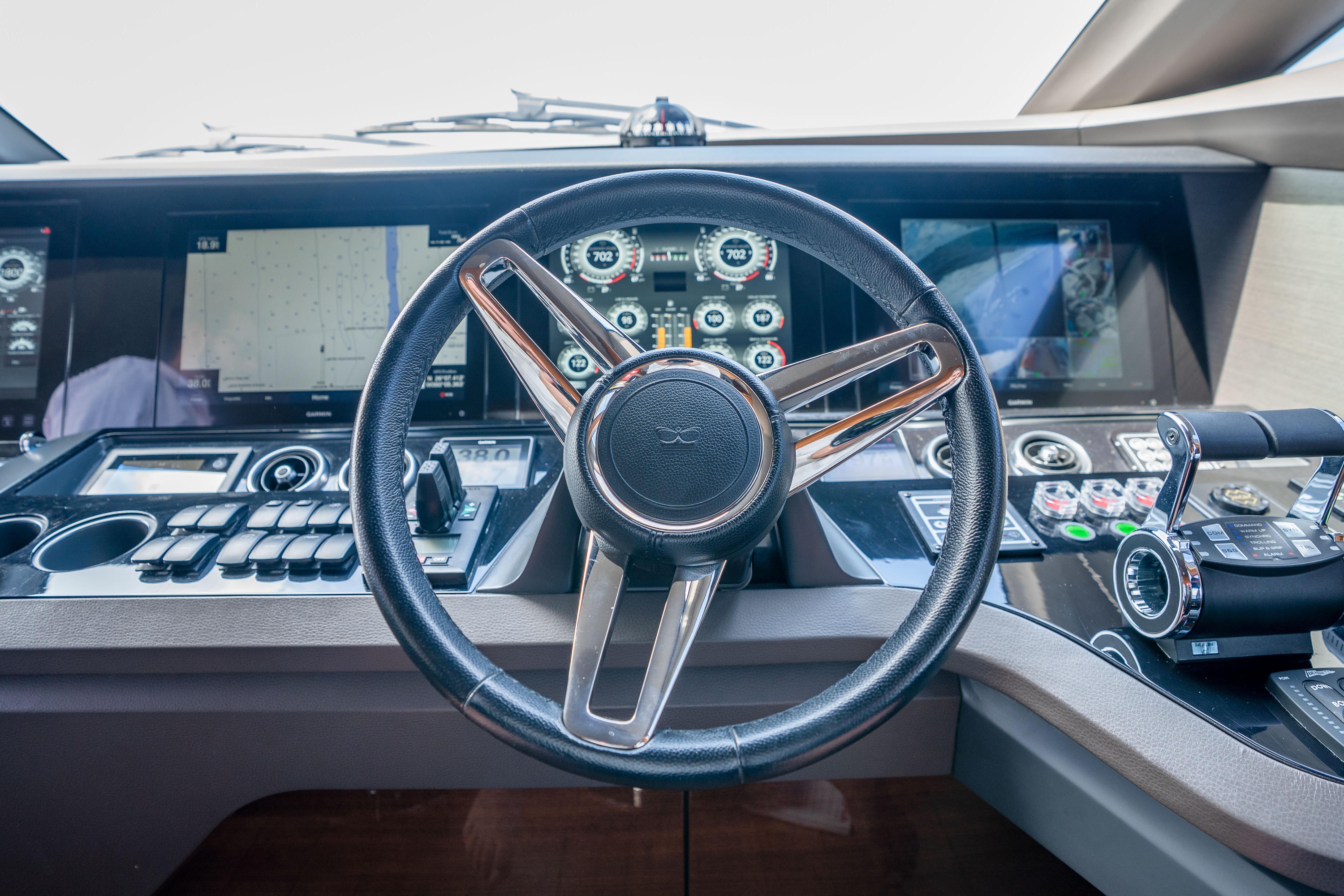 Cockpit of 2020 Princess Y85 yacht with advanced navigation controls and displays.