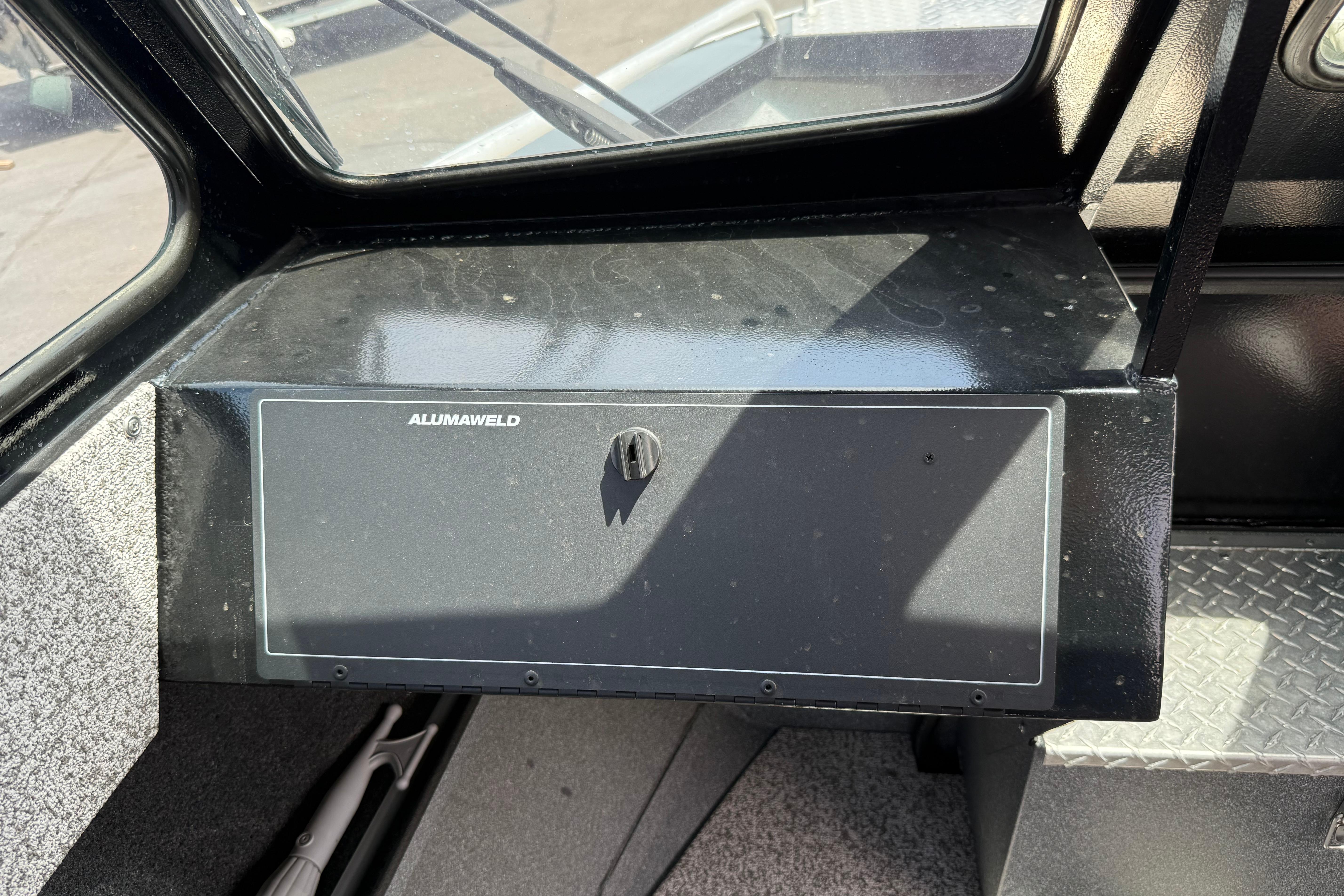 2019 Alumaweld Intruder Hard Top 22' dashboard with storage compartment and sleek design.