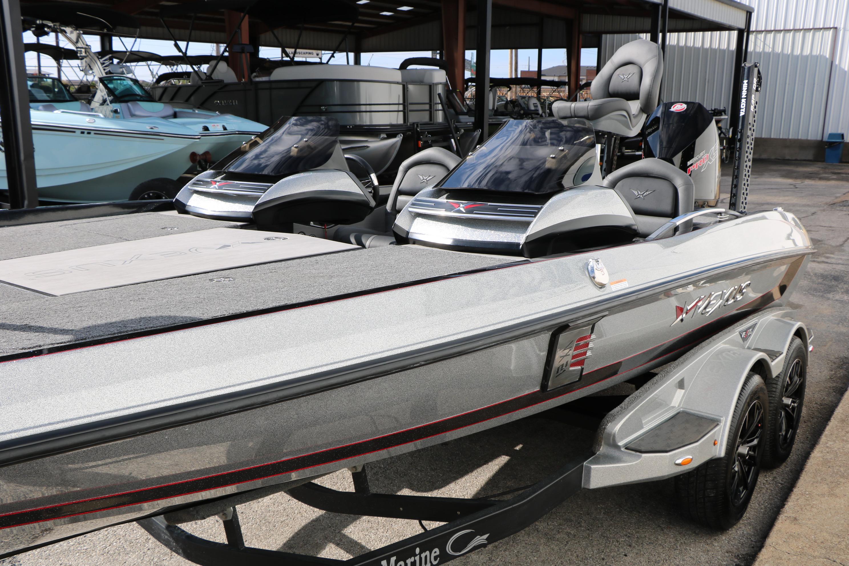 2022 Vexus VX21 boat in a showroom, showcasing sleek design and modern features.