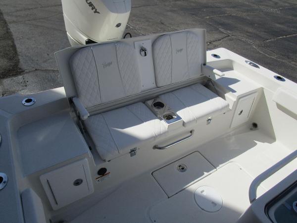 2024 Ranger 2660 Bay boat seating area with storage compartments and cup holders.