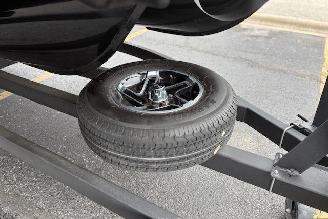 2025 Ranger Reata 243C trailer with spare tire mounted underneath.
