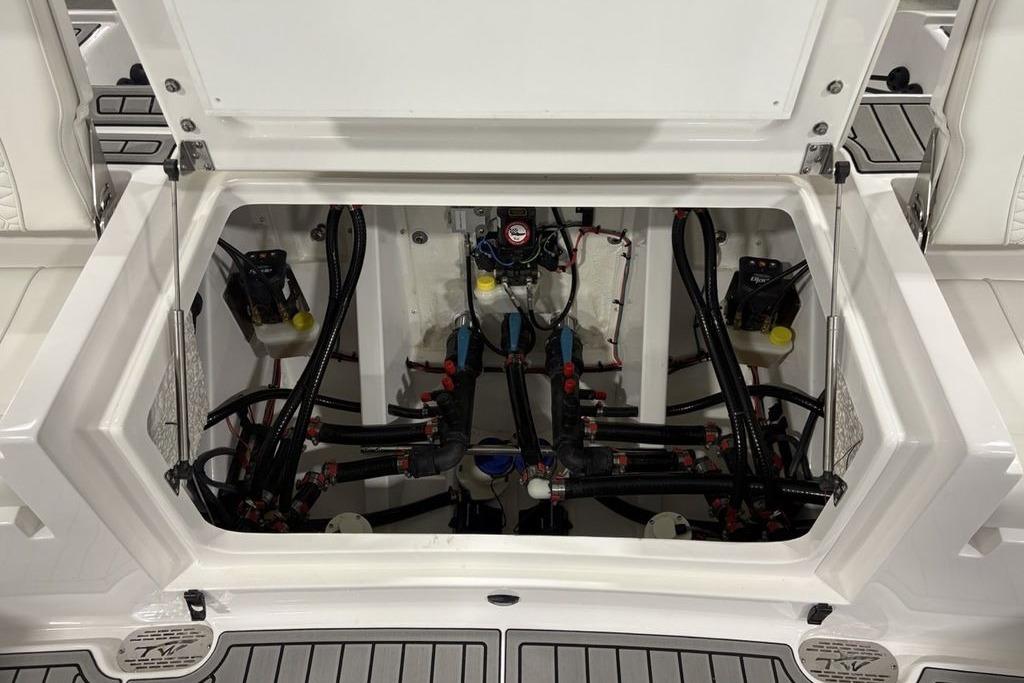 2026 Tidewater 3100 Carolina Bay boat compartment with visible wiring and components.