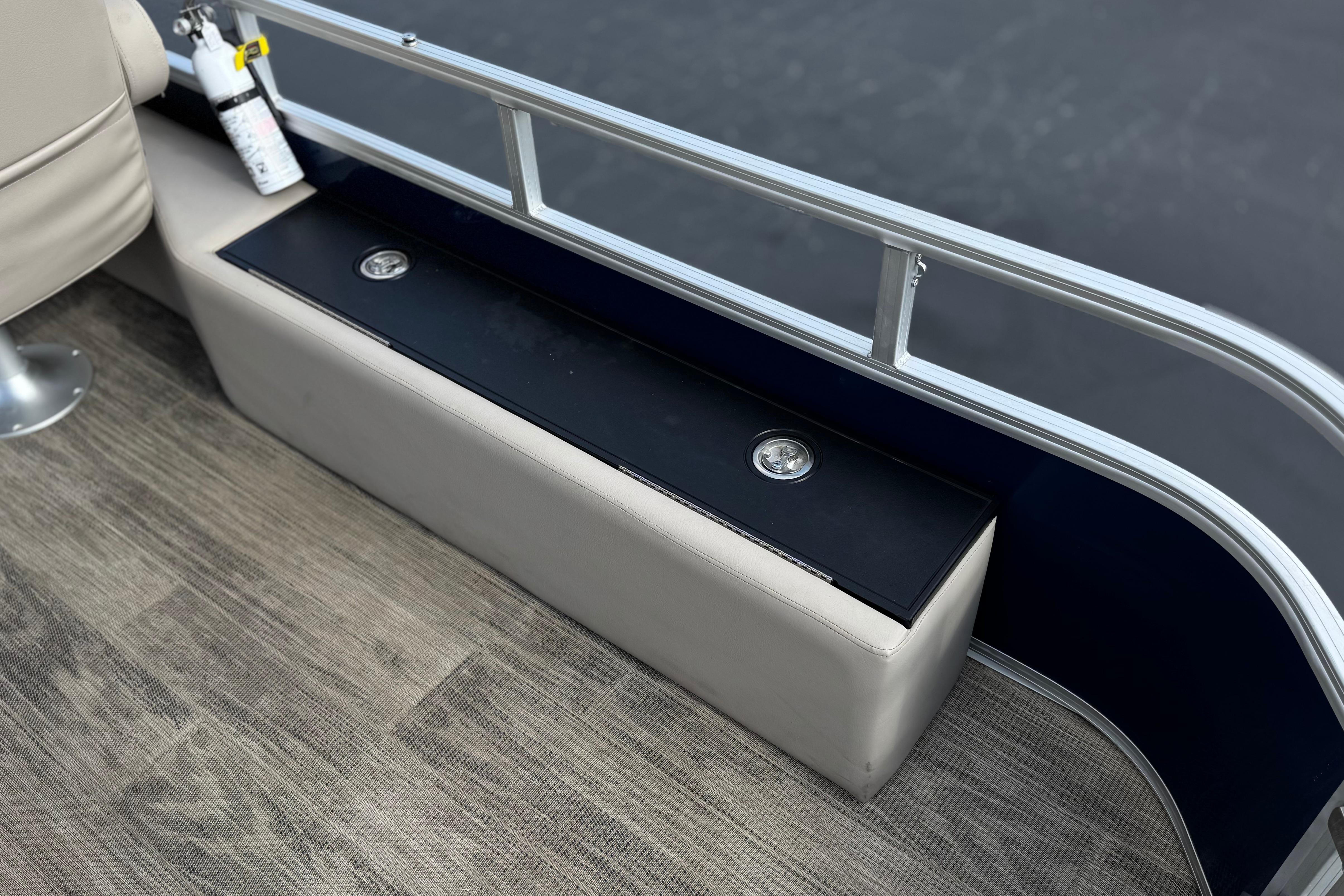 2024 Ranger Reata 223F boat interior with seating, storage, and safety equipment.