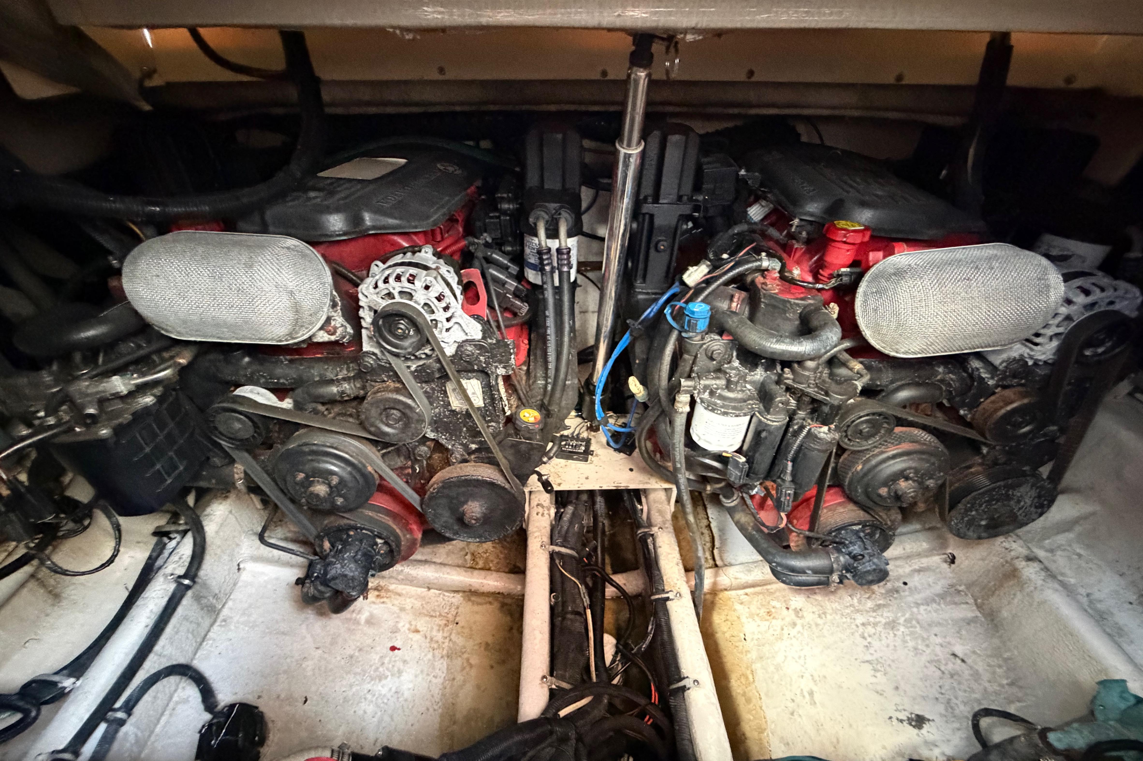 Engine compartment of a 2007 Monterey 350 Sport Yacht, showcasing dual engines and mechanical components.