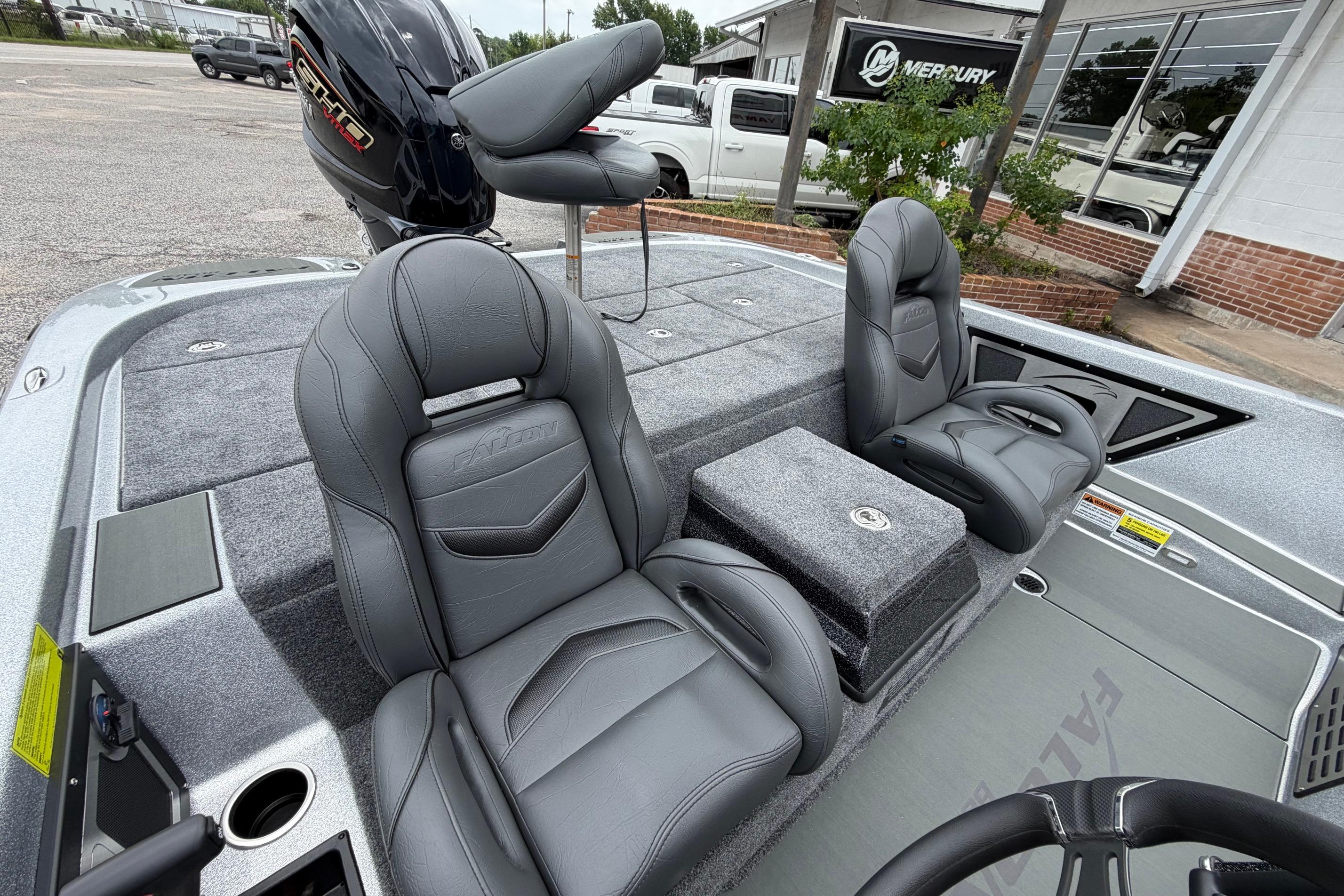 2027 Falcon F20 PREDATOR boat interior with gray leather seats and Mercury engine.