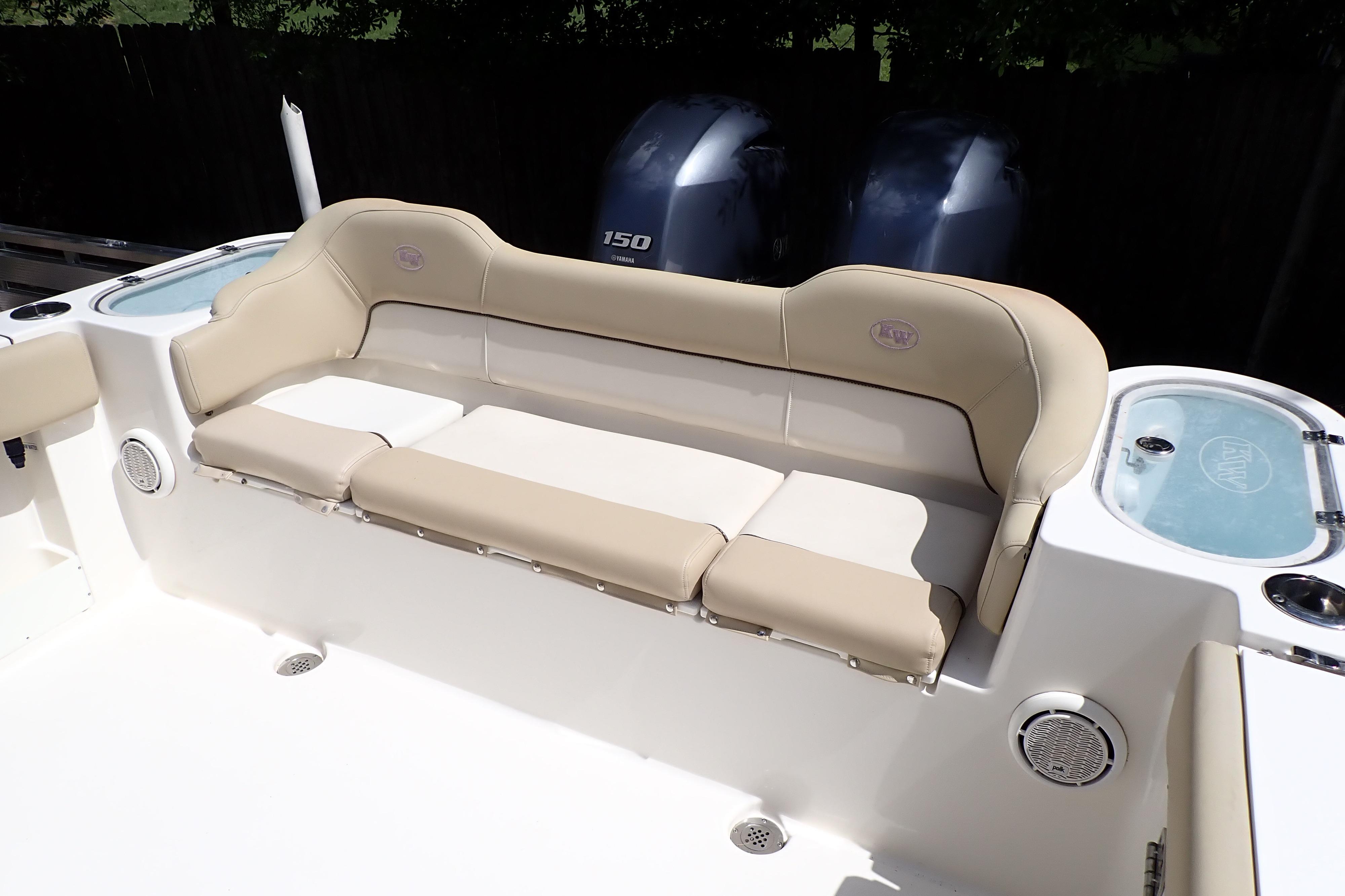 2019 Key West 263 FS boat with beige seating and twin Yamaha 150 engines.