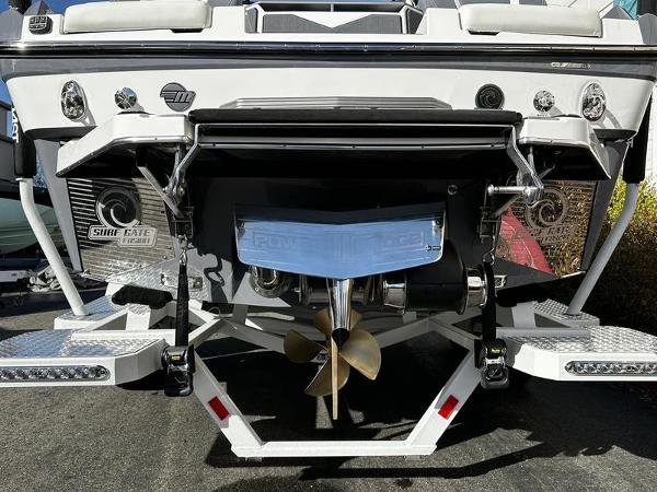2025 Malibu M230 boat stern with propeller and surf gate system.