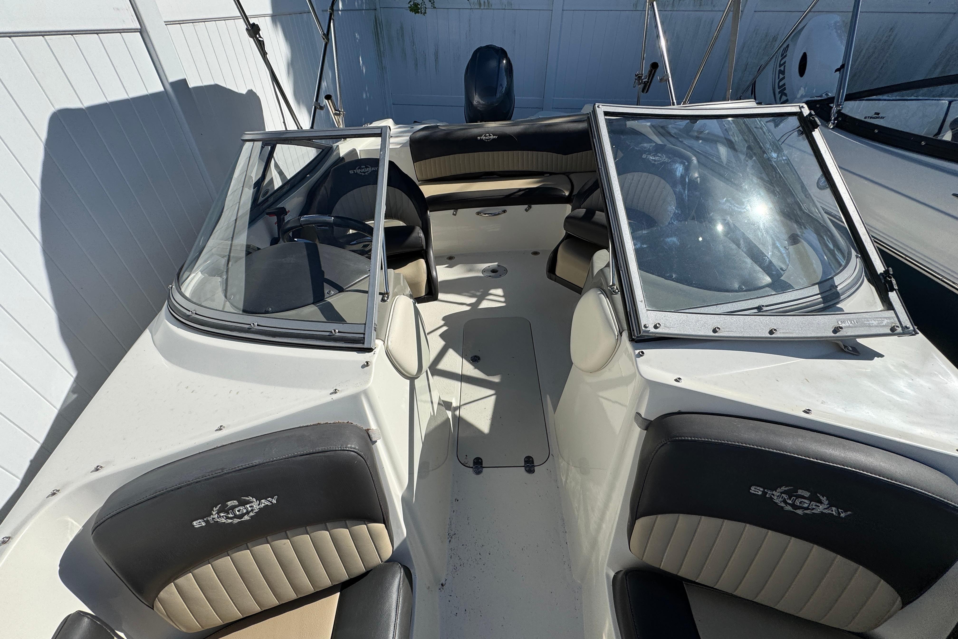 2018 Stingray 204 LR boat interior with dual windshields and seating.
