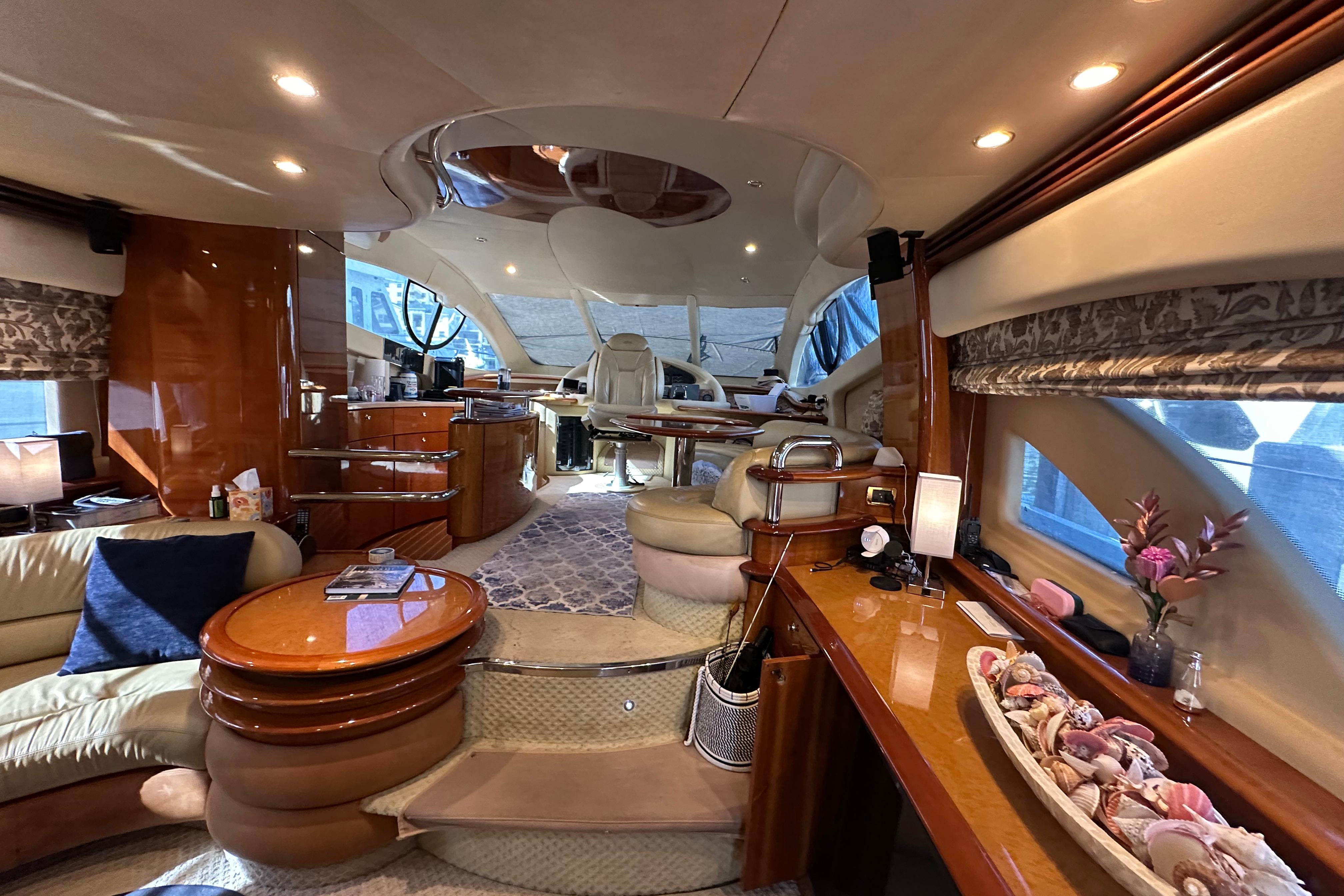 Luxurious interior of a 2004 Azimut 55E yacht with elegant furnishings and decor.