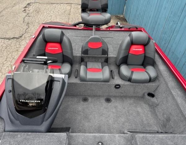 2025 Tracker Savage 215 boat interior with gray and red seating.