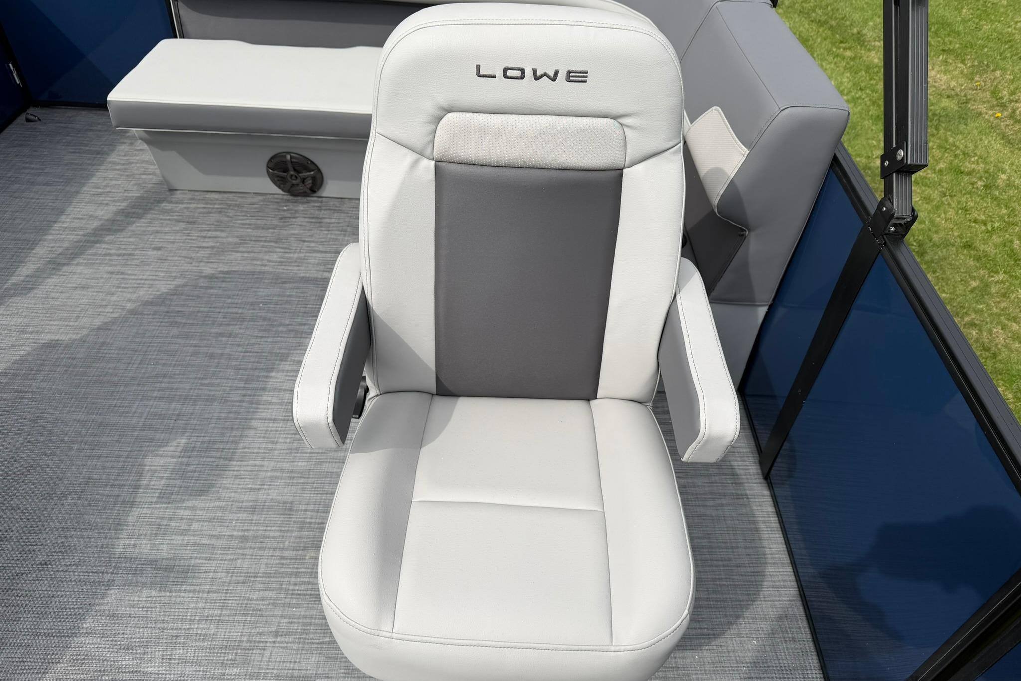 Luxurious 2026 Lowe LS 190 boat seat with armrests on a sleek deck.