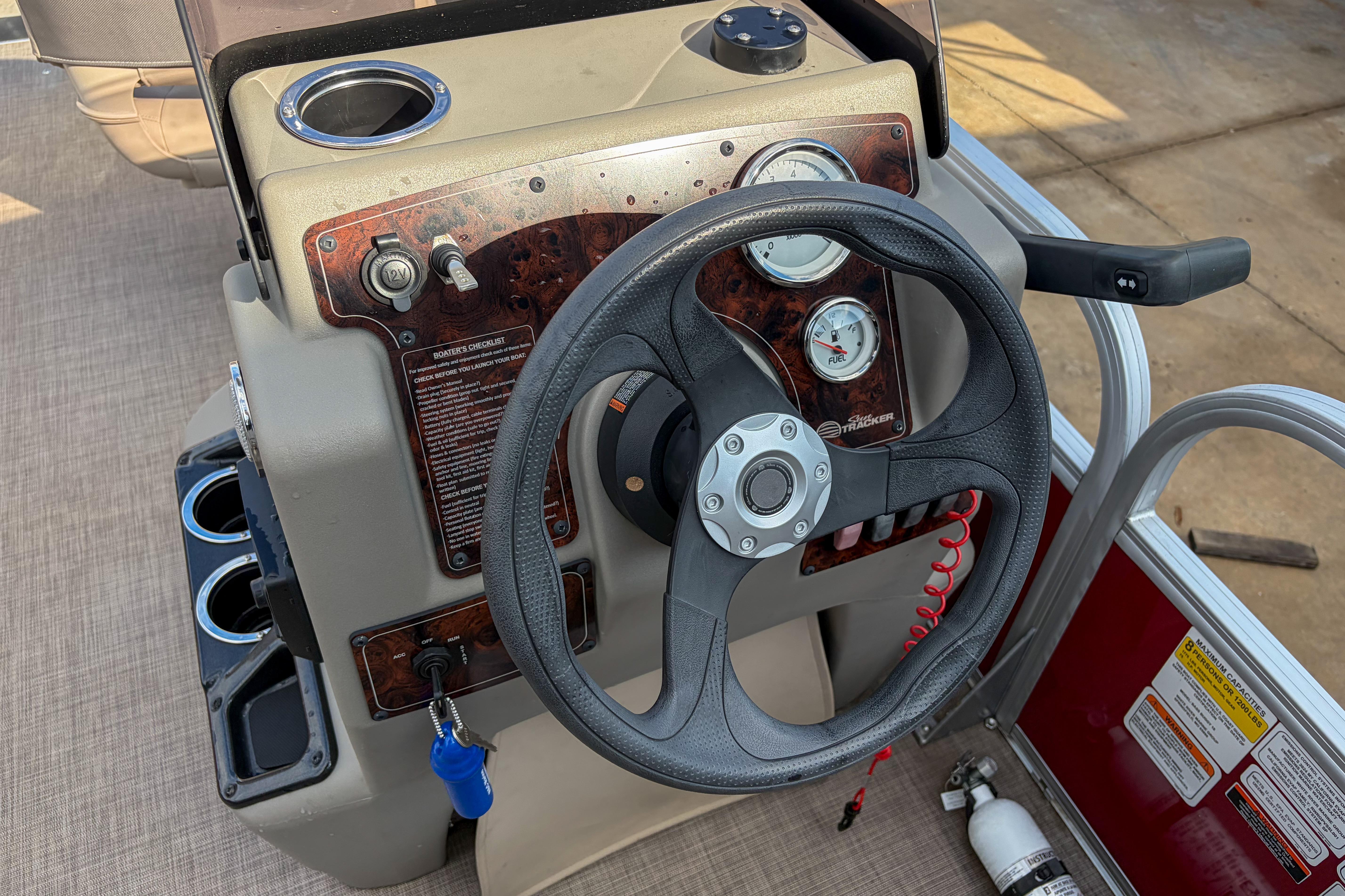 2024 Sun Tracker Bass Buggy 18 DLX steering console with gauges and controls.