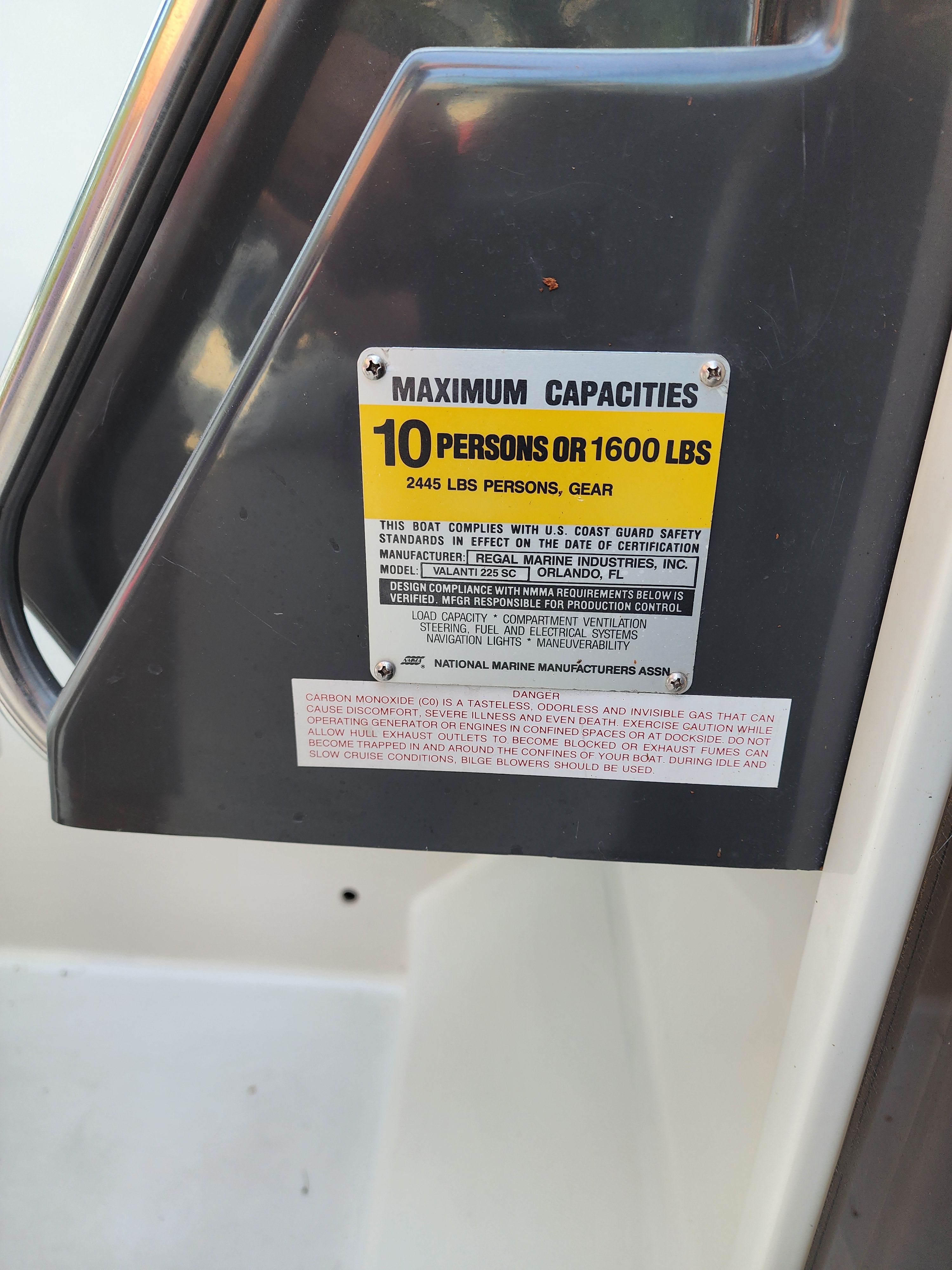 Capacity label on Regal Valante 225C boat, year 1990.