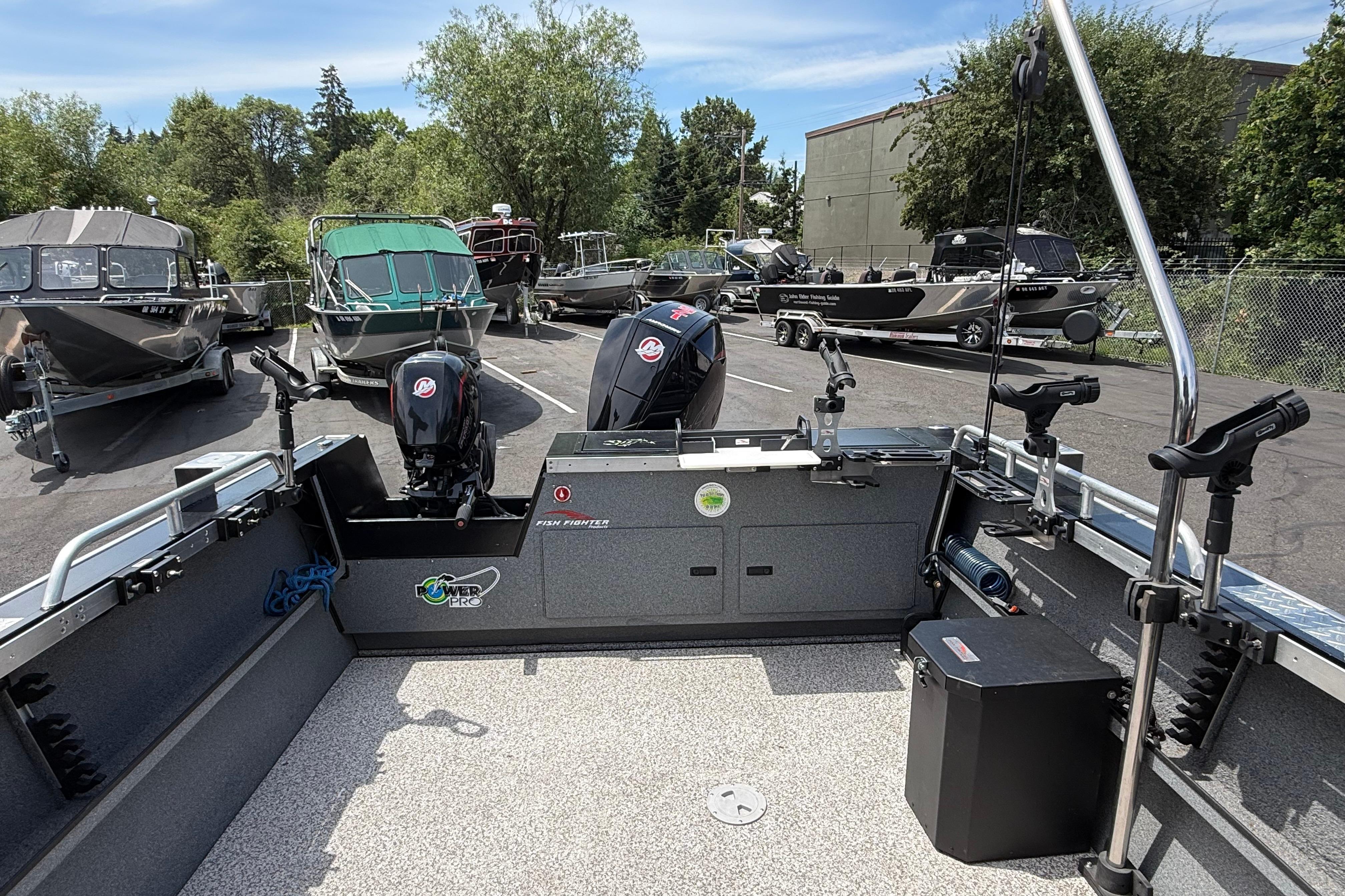 2019 Alumaweld Intruder Hard Top 22' boat with dual Mercury engines in a marina setting.