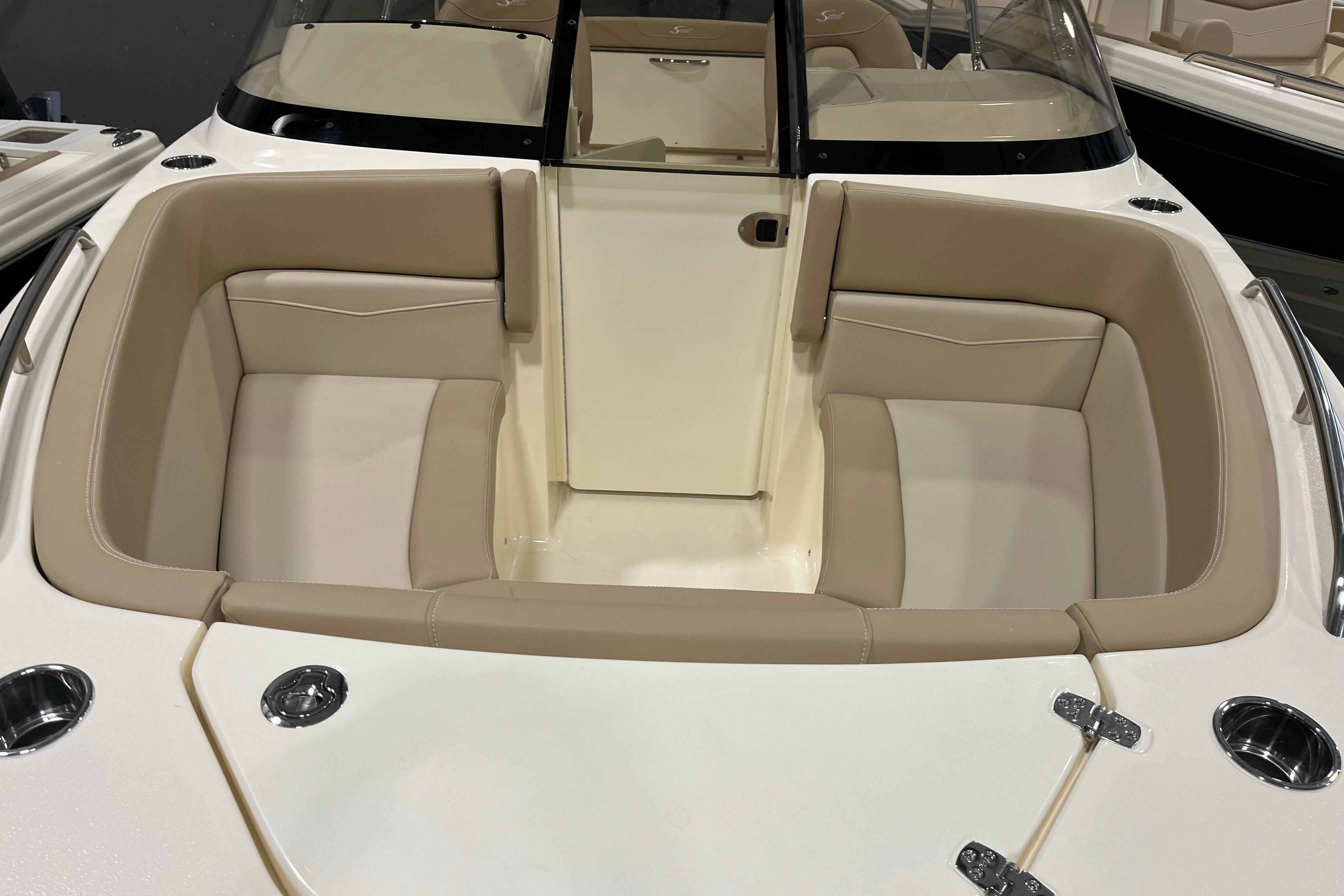 2025 Scout 215 Dorado boat interior with beige seating and sleek design.