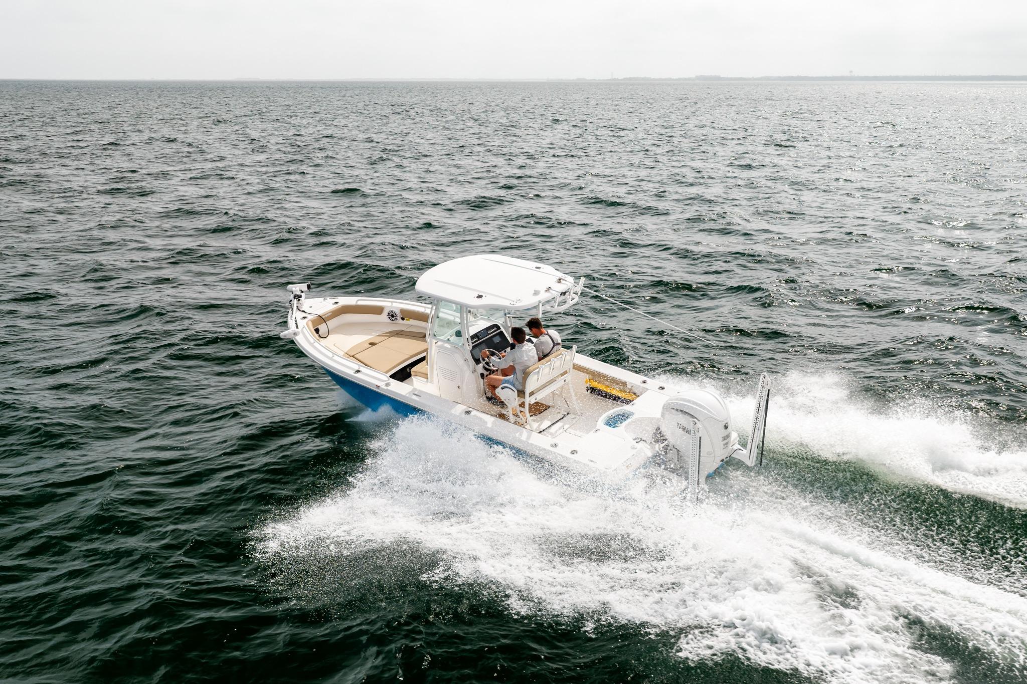 2023 Everglades 243 Center Console boat cruising on open water.