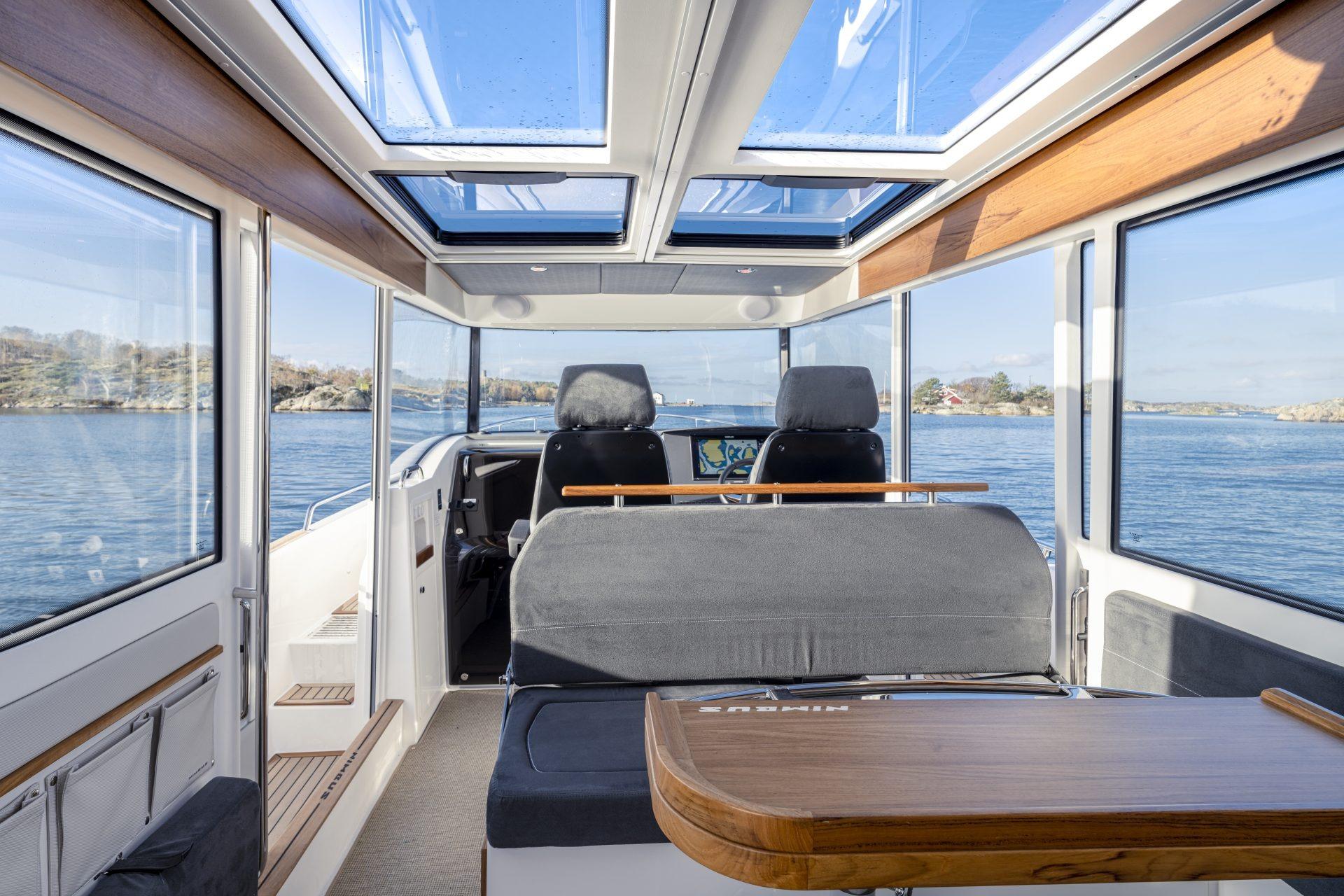 Interior of Nimbus Commuter 11 boat, 2025 model, featuring panoramic windows.