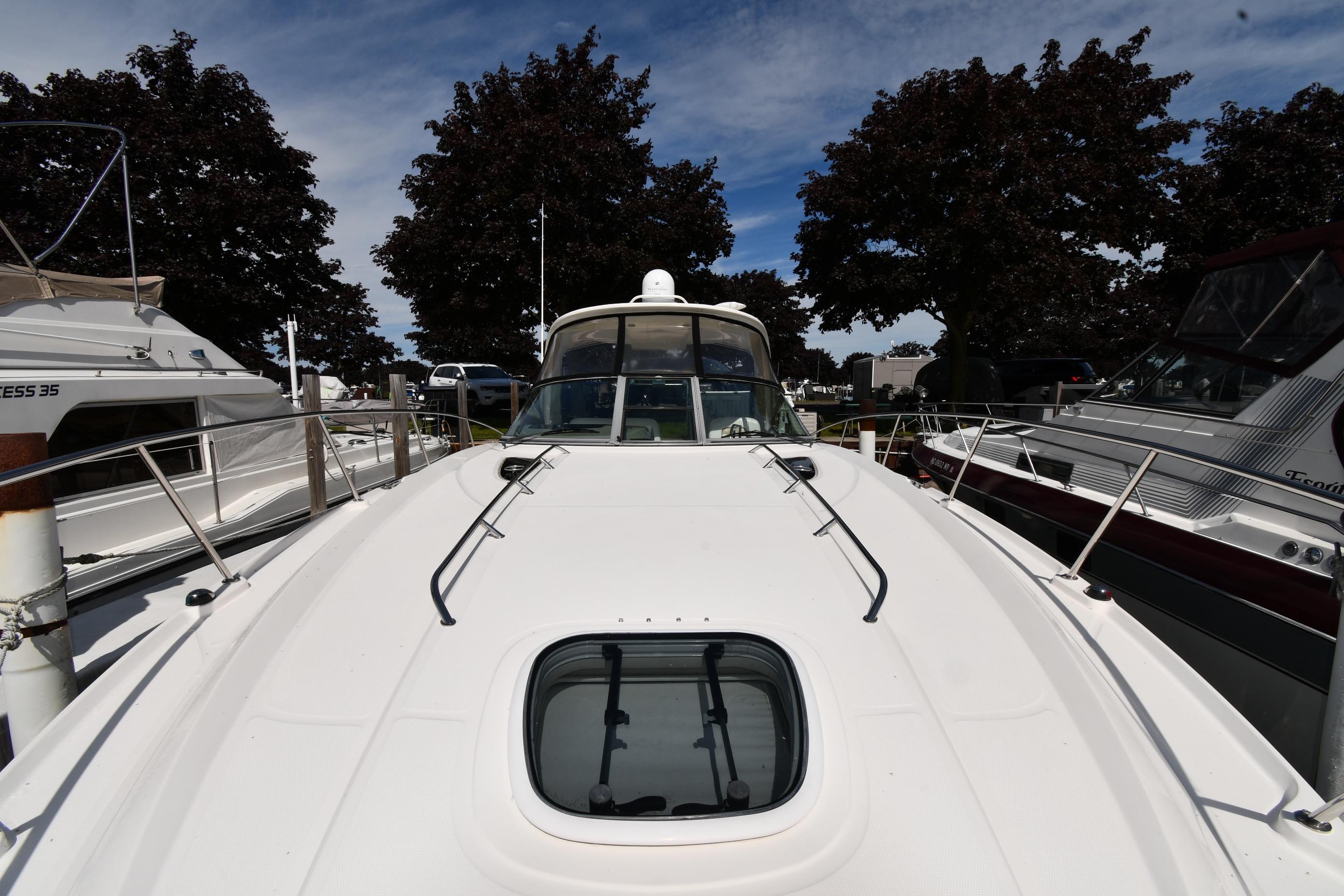 2008 Sea Ray Sundancer 350 yacht docked, showcasing sleek design and spacious deck.