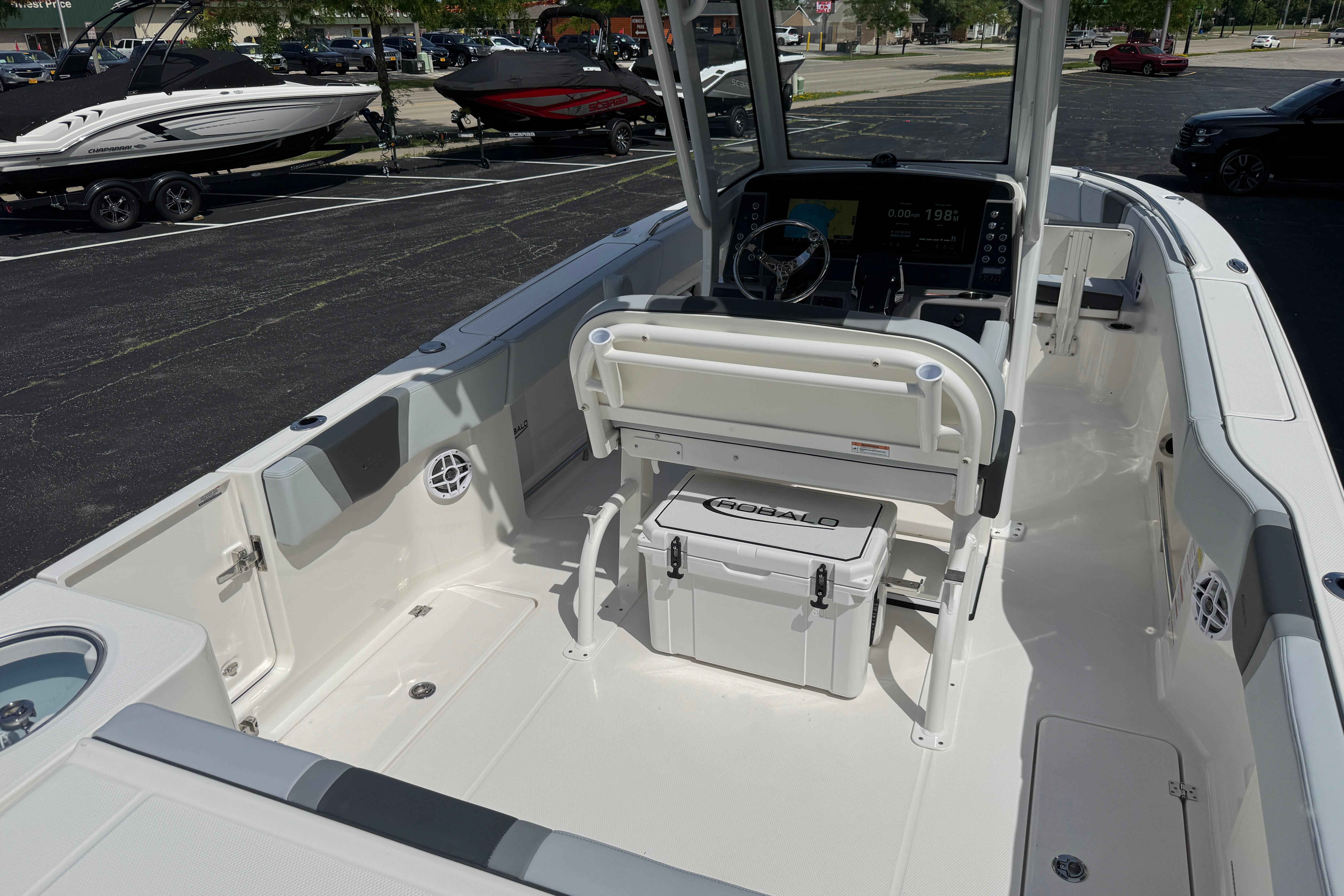 2026 Robalo R250 Center Console boat interior with steering console and seating.