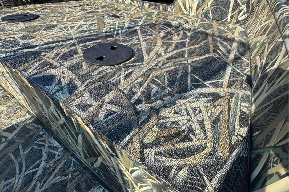 2026 Smoker Craft Sportsman 1866 boat deck with camouflage pattern.