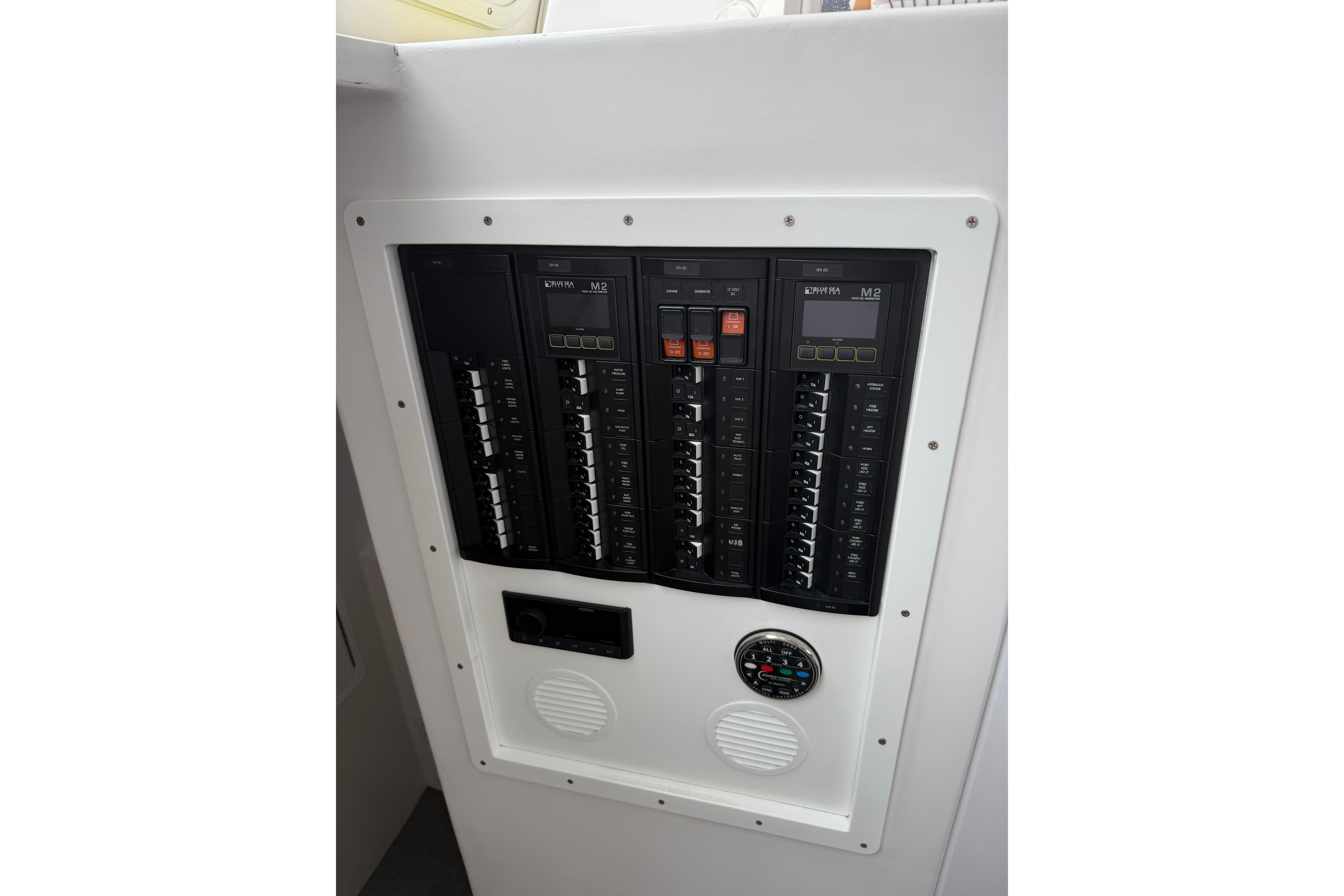 Electrical panel on a 2018 H&H Marine Osmond Beal boat, featuring circuit breakers and gauges.