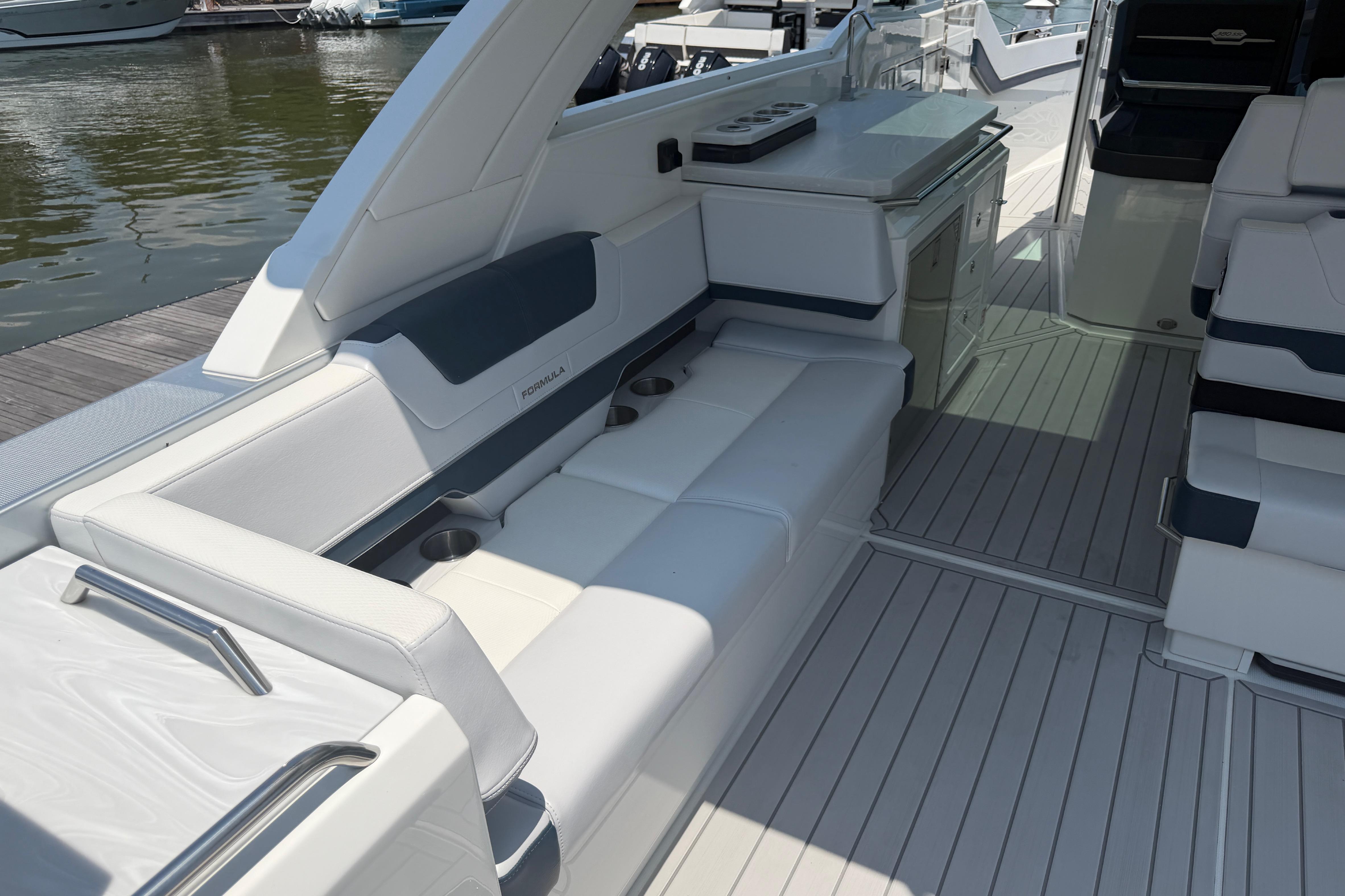Luxurious interior of 2026 Formula 380 Super Sport Crossover OB boat, featuring sleek seating and cabinetry.