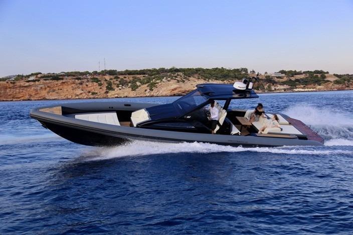 2020 Technohull Explorer cruising on open water near rocky coastline.