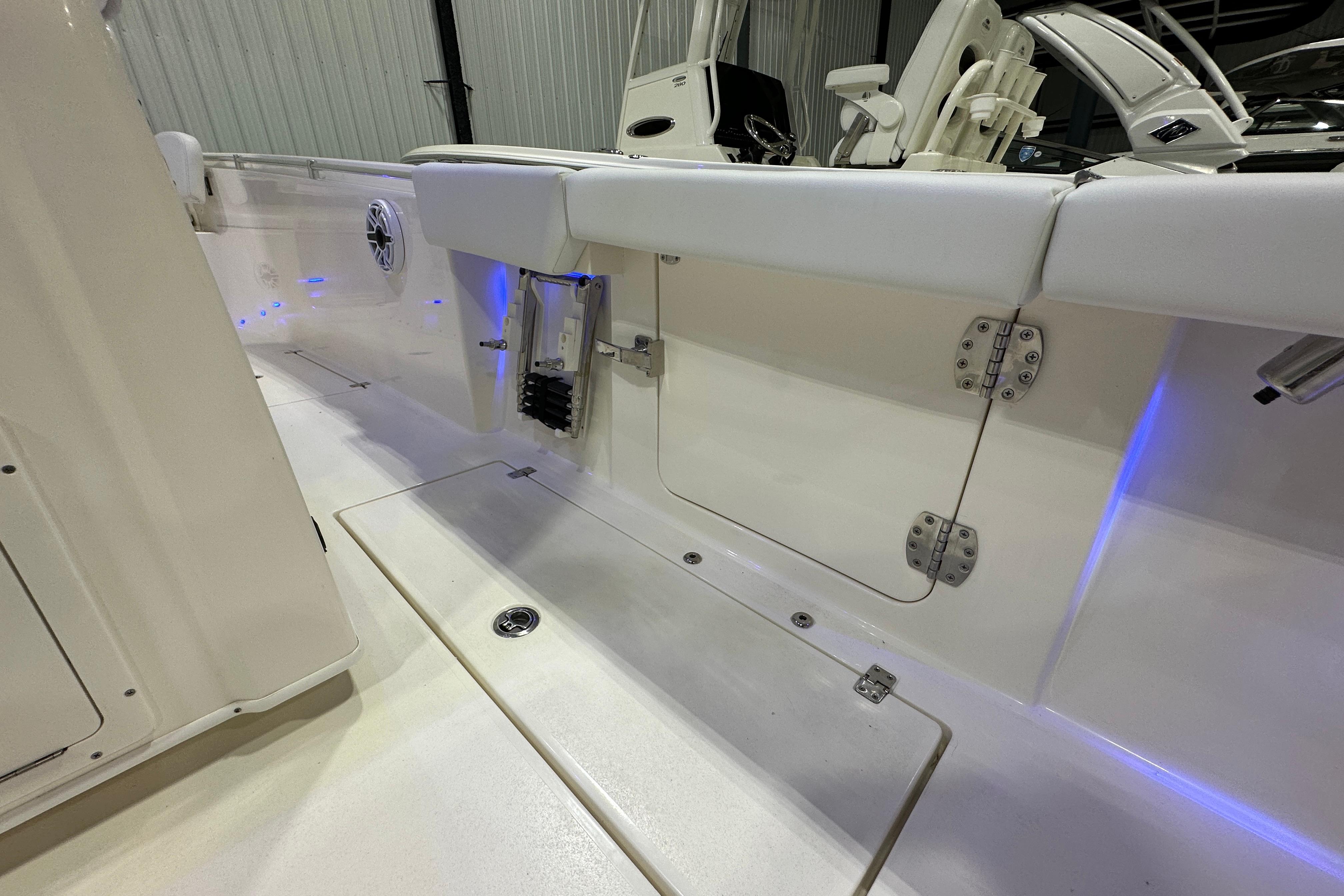 2024 Cobia 301 Center Console boat interior with sleek design and blue LED lighting.